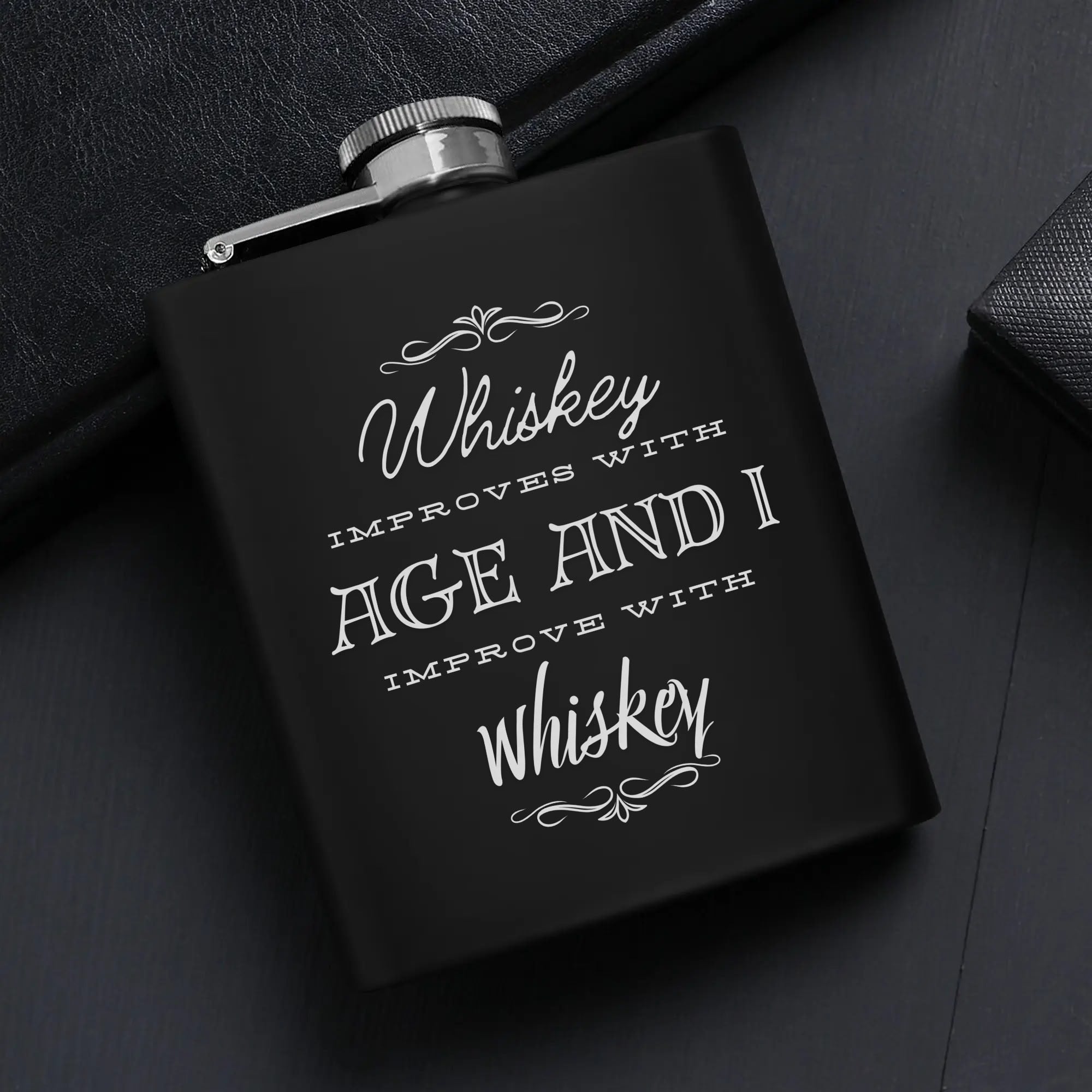 Funny Gag Gift for men | Stainless Steel Hip Flask Gift Set with Funnel & Shot Glasses – I improve with Whiskey