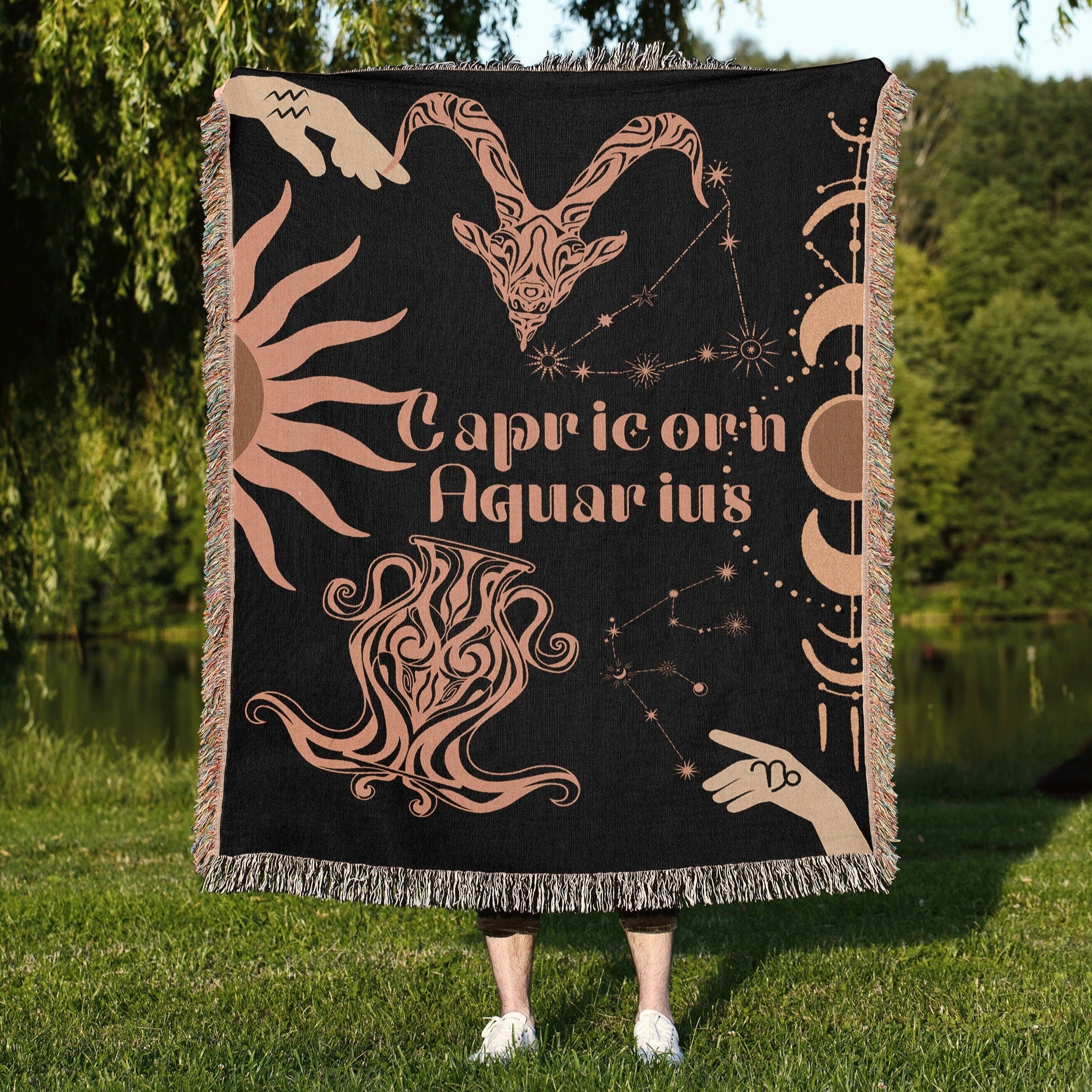 Woven tapestry throw blanket featuring the Aquarius and Capricorn zodiac symbols. Perfect for astrology enthusiasts, this cotton throw blanket adds a touch of boho style and celestial charm to your home decor.
