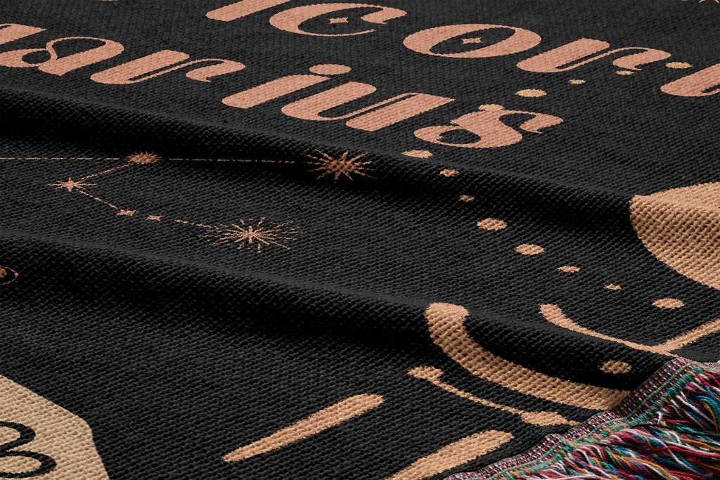 Woven tapestry throw blanket featuring the Aquarius and Capricorn zodiac symbols. Perfect for astrology enthusiasts, this cotton throw blanket adds a touch of boho style and celestial charm to your home decor.