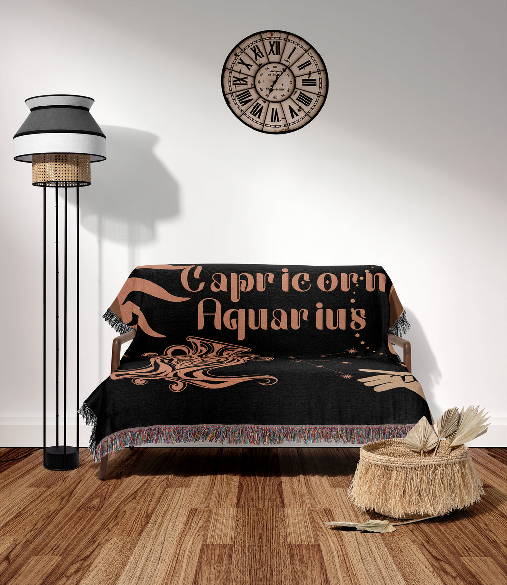 Woven tapestry throw blanket featuring the Aquarius and Capricorn zodiac symbols. Perfect for astrology enthusiasts, this cotton throw blanket adds a touch of boho style and celestial charm to your home decor.