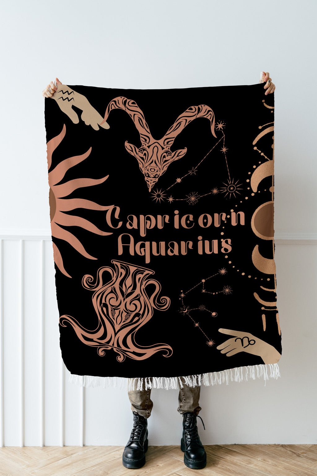 Woven tapestry throw blanket featuring the Aquarius and Capricorn zodiac symbols. Perfect for astrology enthusiasts, this cotton throw blanket adds a touch of boho style and celestial charm to your home decor.