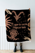 Woven tapestry throw blanket featuring the Aquarius and Capricorn zodiac symbols. Perfect for astrology enthusiasts, this cotton throw blanket adds a touch of boho style and celestial charm to your home decor.
