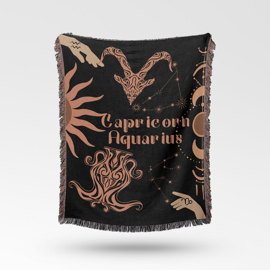 Woven tapestry throw blanket featuring the Aquarius and Capricorn zodiac symbols. Perfect for astrology enthusiasts, this cotton throw blanket adds a touch of boho style and celestial charm to your home decor.