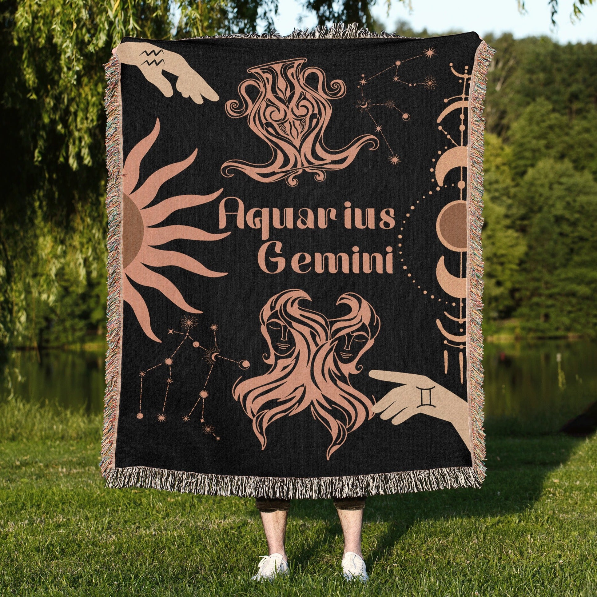 Woven tapestry throw blanket featuring the Aquarius and Gemini zodiac symbols. Perfect for astrology enthusiasts, this cotton throw blanket adds a touch of boho style and celestial charm to your home decor.