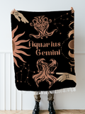 Woven tapestry throw blanket featuring the Aquarius and Gemini zodiac symbols. Perfect for astrology enthusiasts, this cotton throw blanket adds a touch of boho style and celestial charm to your home decor.