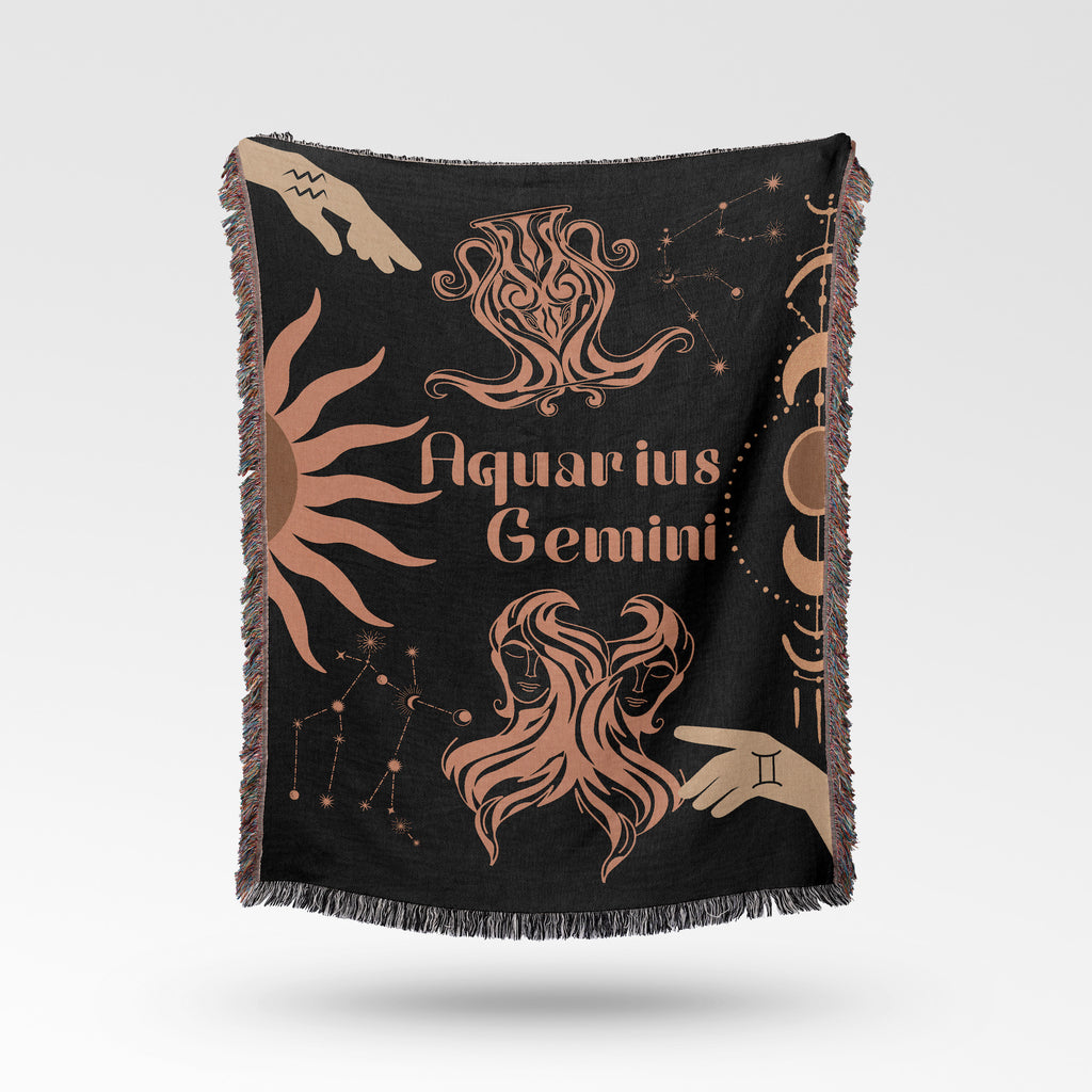 Woven tapestry throw blanket featuring the Aquarius and Gemini zodiac symbols. Perfect for astrology enthusiasts, this cotton throw blanket adds a touch of boho style and celestial charm to your home decor.