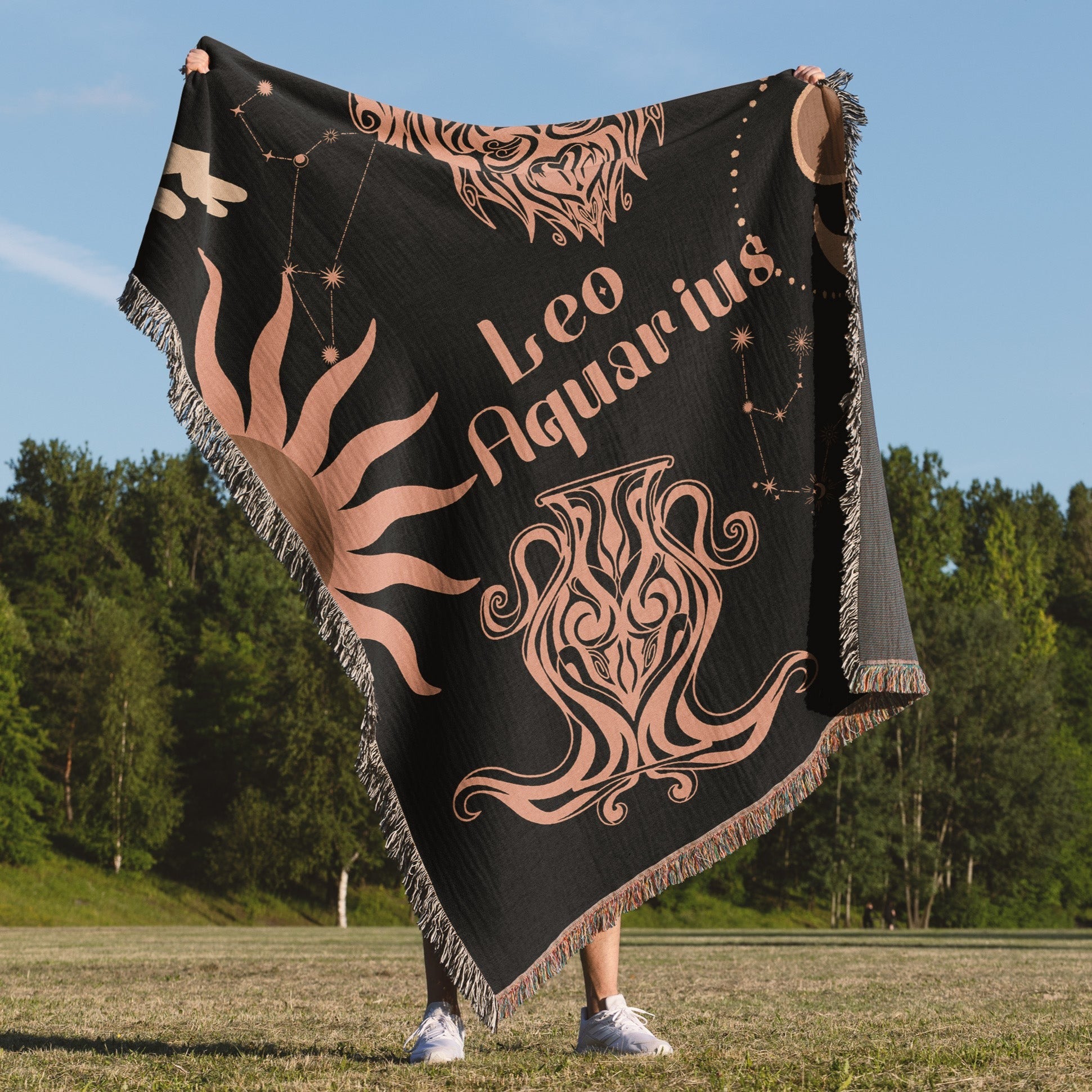 Woven tapestry throw blanket featuring the Aquarius and Leo zodiac symbols. Perfect for astrology enthusiasts, this cotton throw blanket adds a touch of boho style and celestial charm to your home decor.