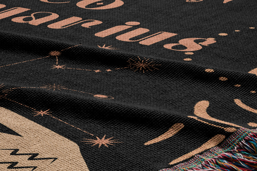Woven tapestry throw blanket featuring the Aquarius and Leo zodiac symbols. Perfect for astrology enthusiasts, this cotton throw blanket adds a touch of boho style and celestial charm to your home decor.