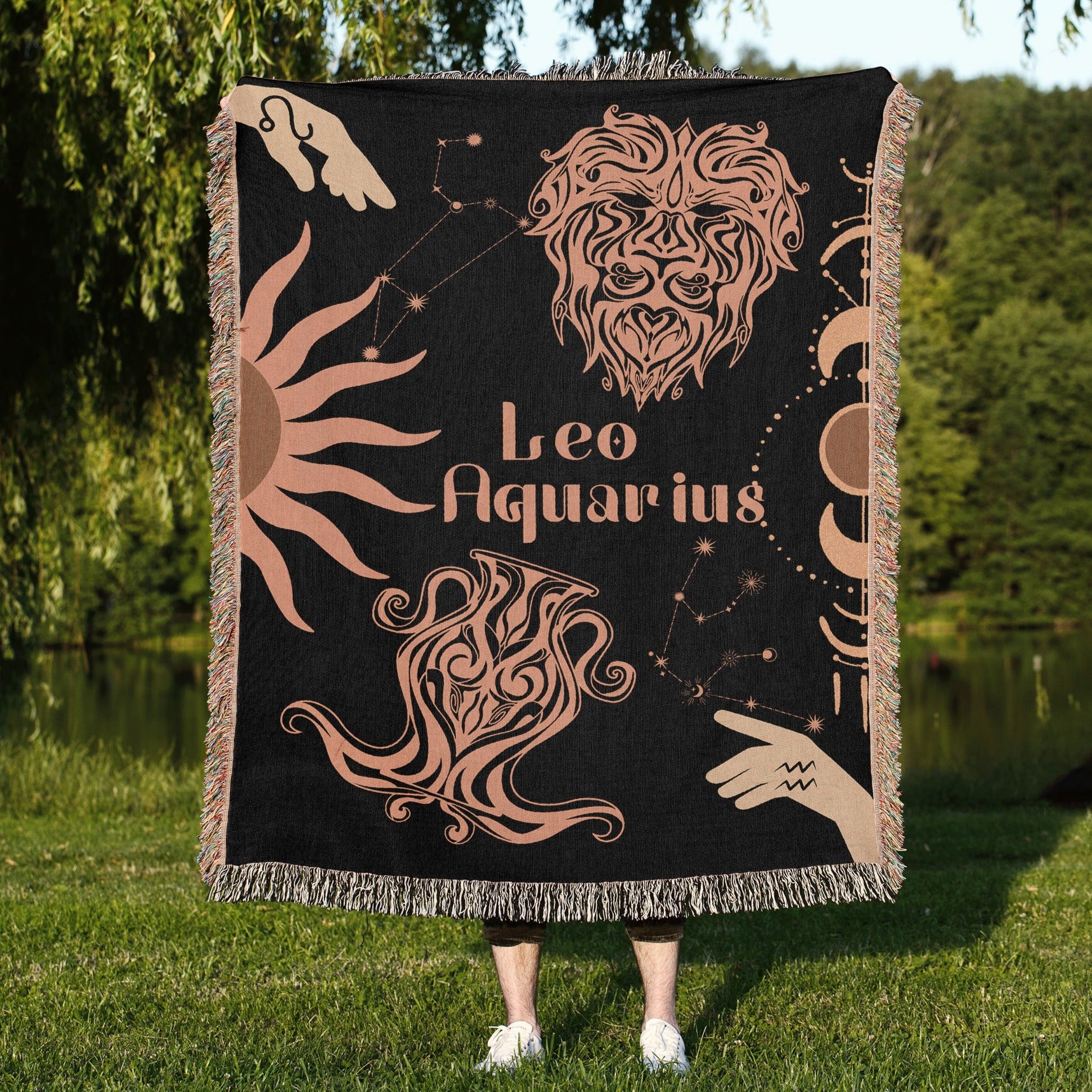 Woven tapestry throw blanket featuring the Aquarius and Leo zodiac symbols. Perfect for astrology enthusiasts, this cotton throw blanket adds a touch of boho style and celestial charm to your home decor.
