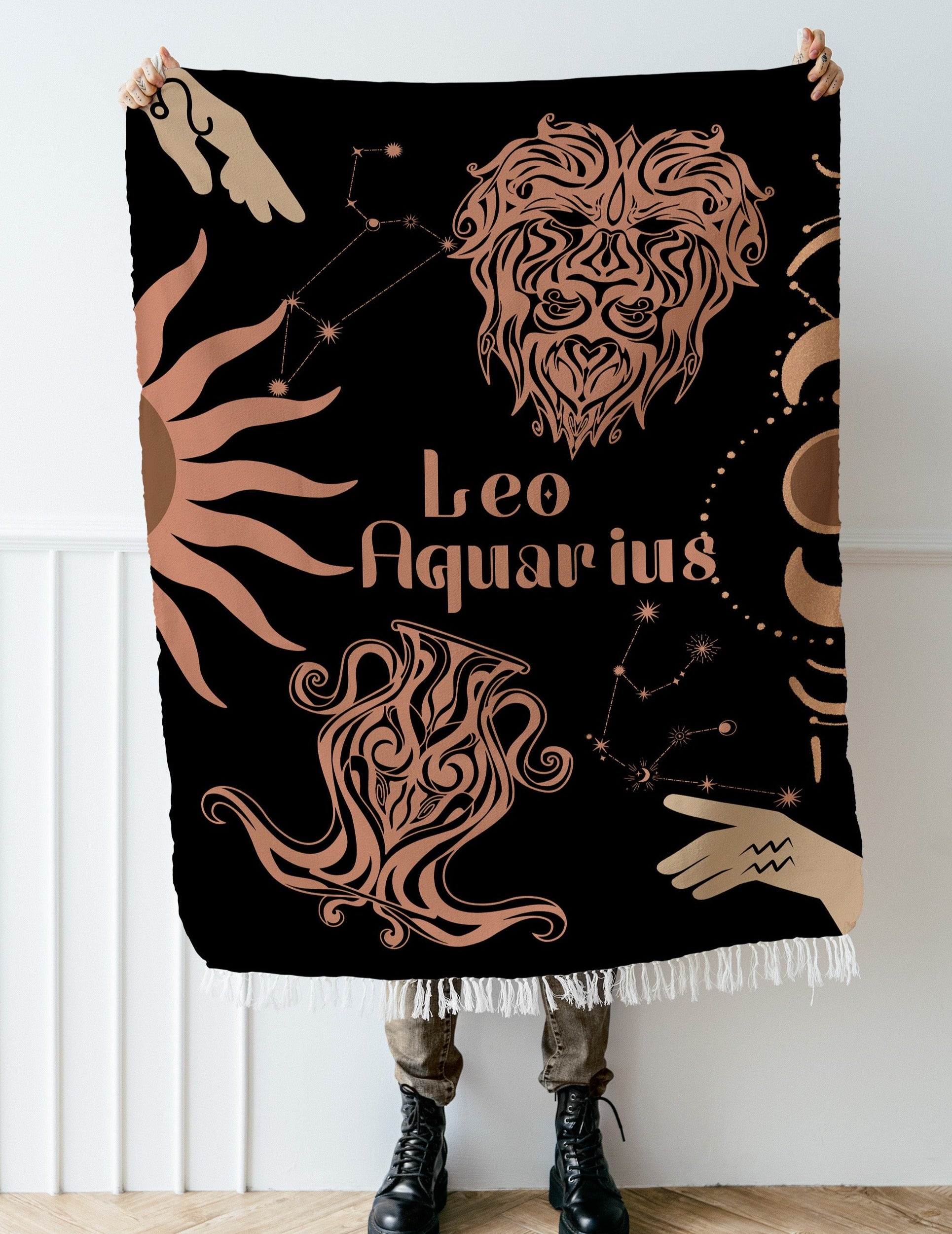 Woven tapestry throw blanket featuring the Aquarius and Leo zodiac symbols. Perfect for astrology enthusiasts, this cotton throw blanket adds a touch of boho style and celestial charm to your home decor.