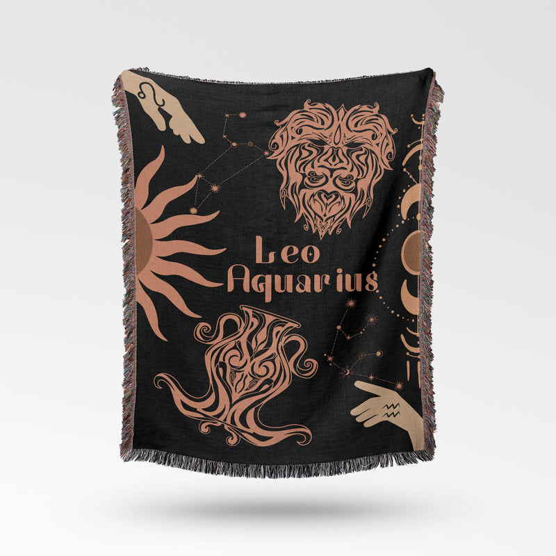 Woven tapestry throw blanket featuring the Aquarius and Leo zodiac symbols. Perfect for astrology enthusiasts, this cotton throw blanket adds a touch of boho style and celestial charm to your home decor.