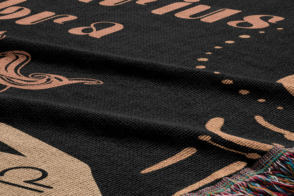 Woven tapestry throw blanket featuring the Aquarius and Libra zodiac symbols. Perfect for astrology enthusiasts, this cotton throw blanket adds a touch of boho style and celestial charm to your home decor.