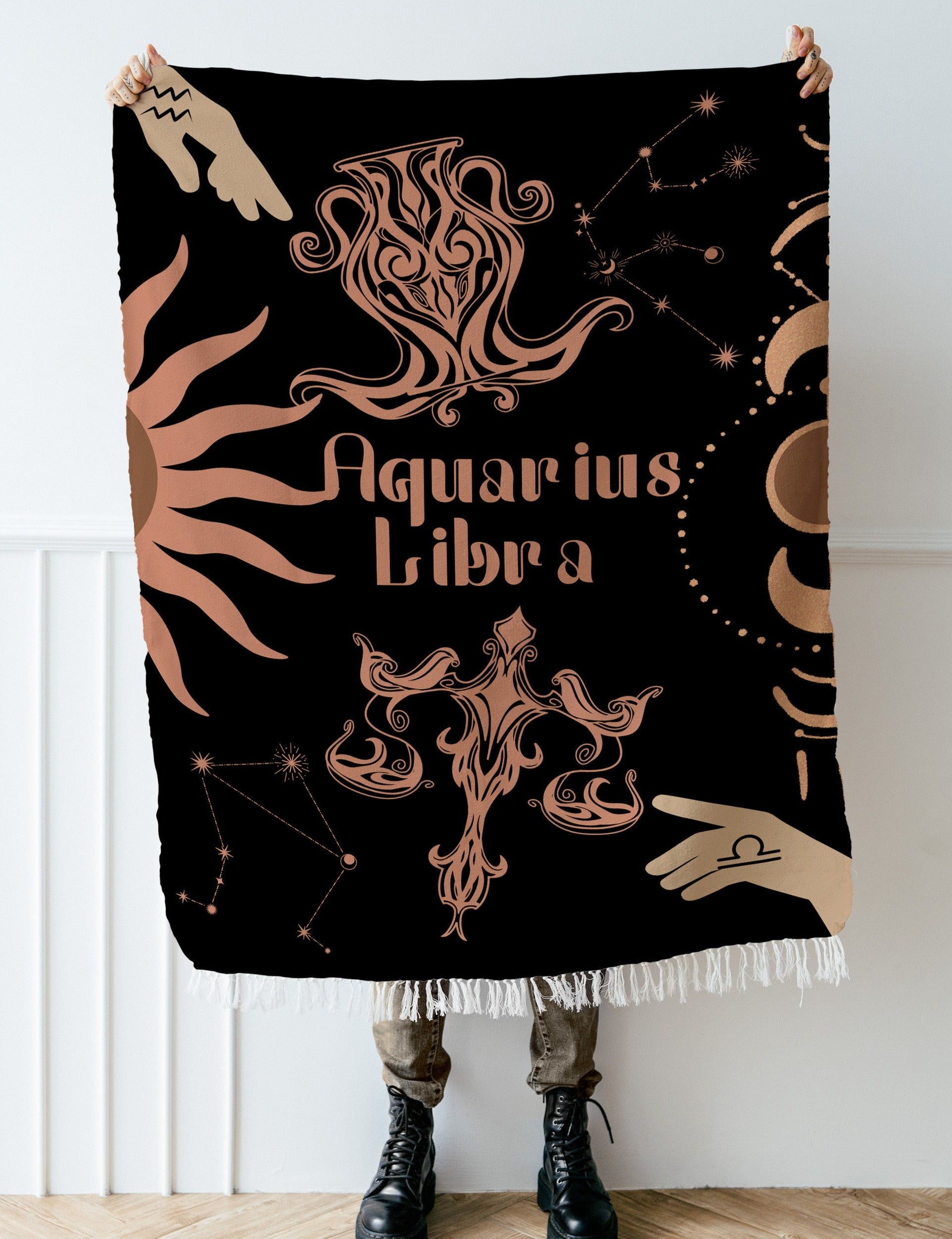 Woven tapestry throw blanket featuring the Aquarius and Libra zodiac symbols. Perfect for astrology enthusiasts, this cotton throw blanket adds a touch of boho style and celestial charm to your home decor.