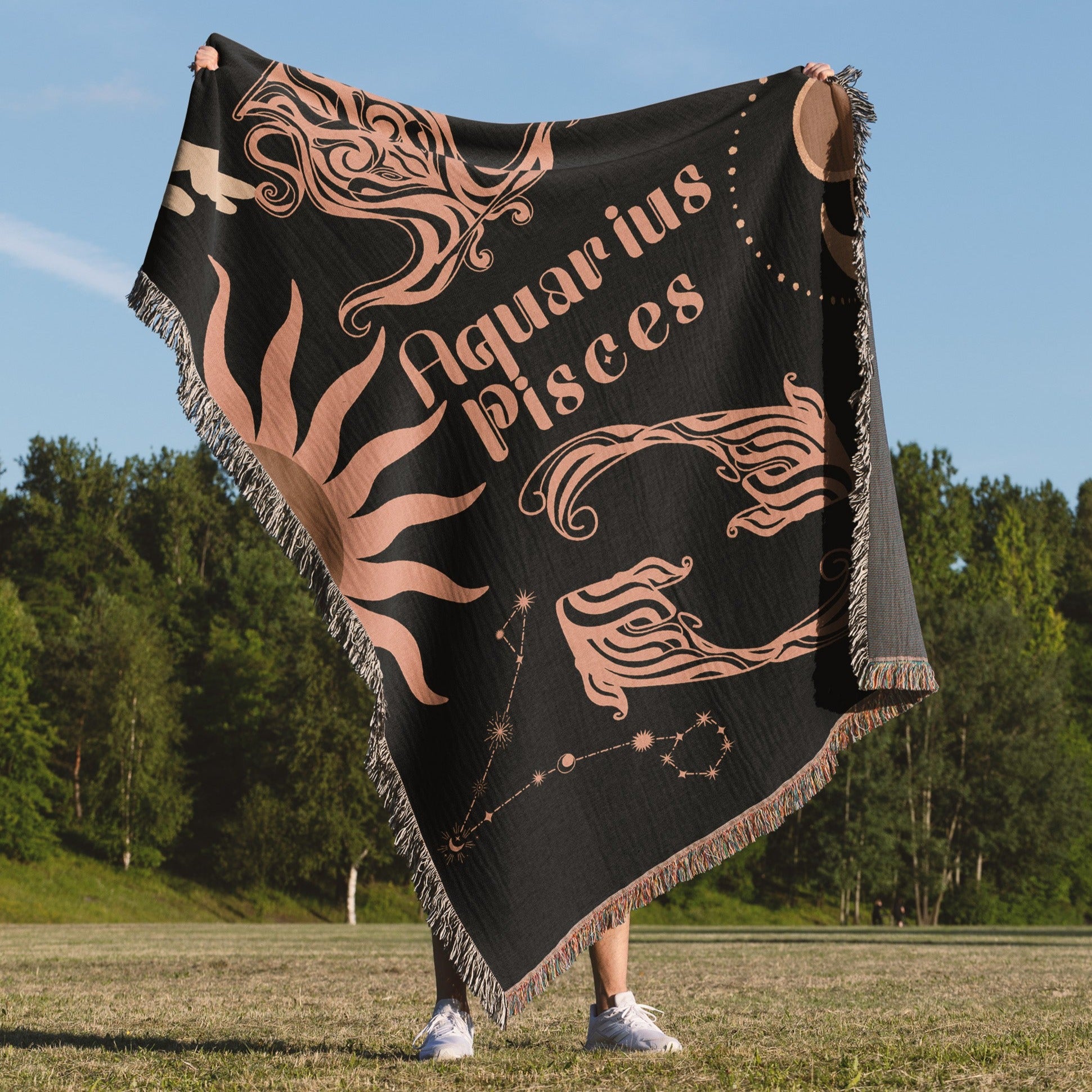 Woven tapestry throw blanket featuring the Aquarius and Pisces zodiac symbols. Perfect for astrology enthusiasts, this cotton throw blanket adds a touch of boho style and celestial charm to your home decor.