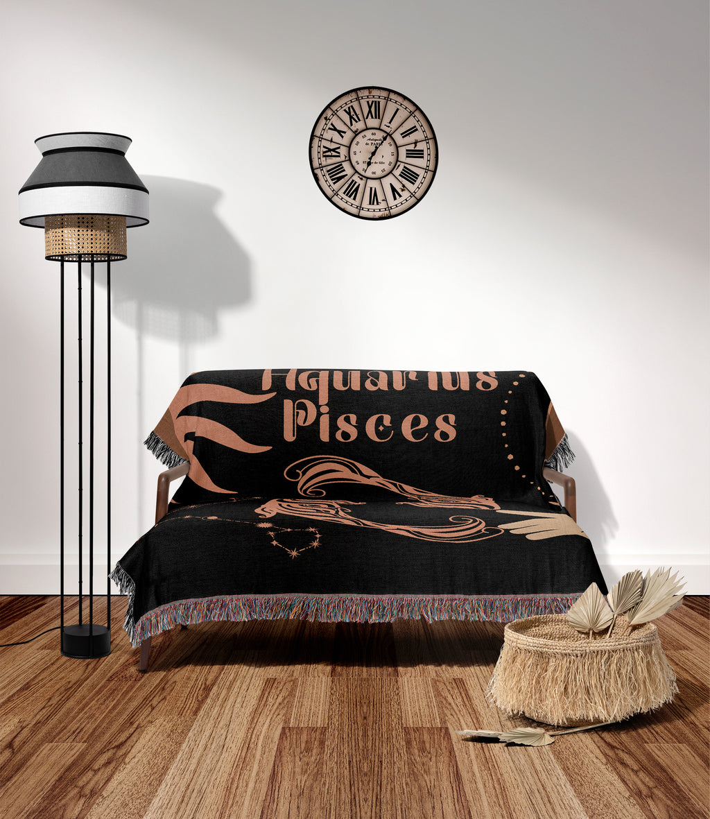 Woven tapestry throw blanket featuring the Aquarius and Pisces zodiac symbols. Perfect for astrology enthusiasts, this cotton throw blanket adds a touch of boho style and celestial charm to your home decor.