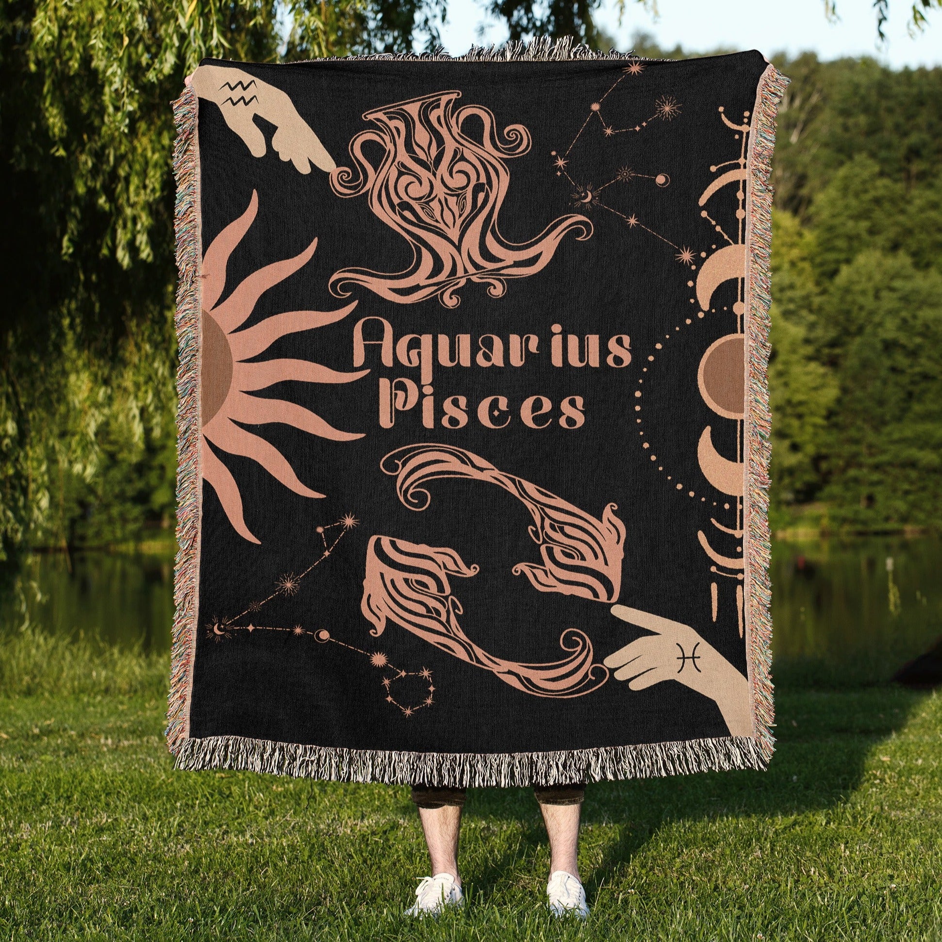 Woven tapestry throw blanket featuring the Aquarius and Pisces zodiac symbols. Perfect for astrology enthusiasts, this cotton throw blanket adds a touch of boho style and celestial charm to your home decor.
