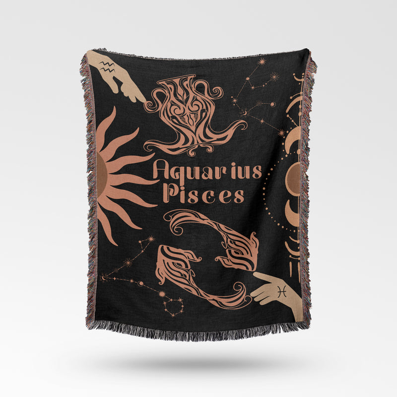 Woven tapestry throw blanket featuring the Aquarius and Pisces zodiac symbols. Perfect for astrology enthusiasts, this cotton throw blanket adds a touch of boho style and celestial charm to your home decor.