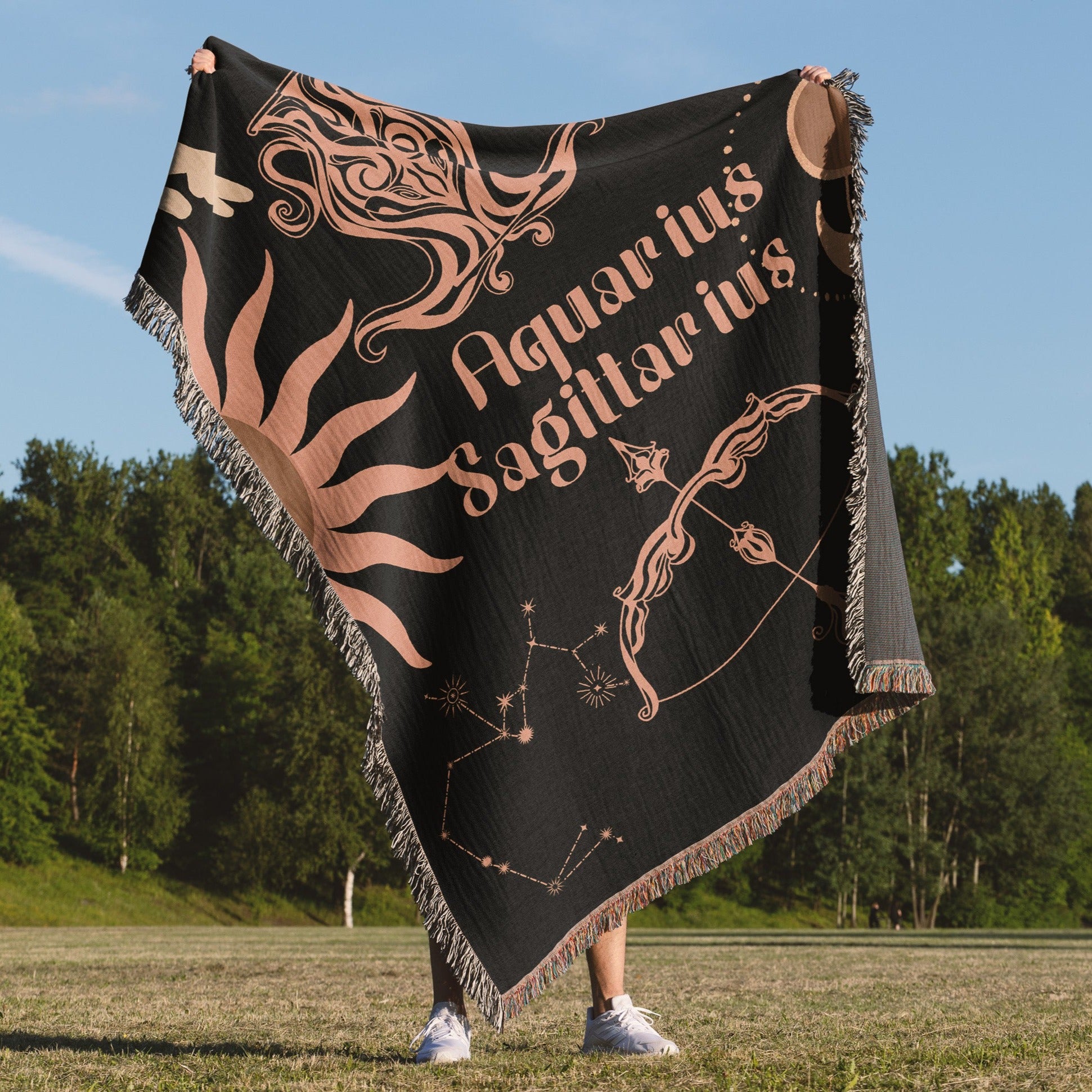 Woven tapestry throw blanket featuring the Aquarius and Sagittarius zodiac symbols. Perfect for astrology enthusiasts, this cotton throw blanket adds a touch of boho style and celestial charm to your home decor.