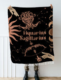 Woven tapestry throw blanket featuring the Aquarius and Sagittarius zodiac symbols. Perfect for astrology enthusiasts, this cotton throw blanket adds a touch of boho style and celestial charm to your home decor.