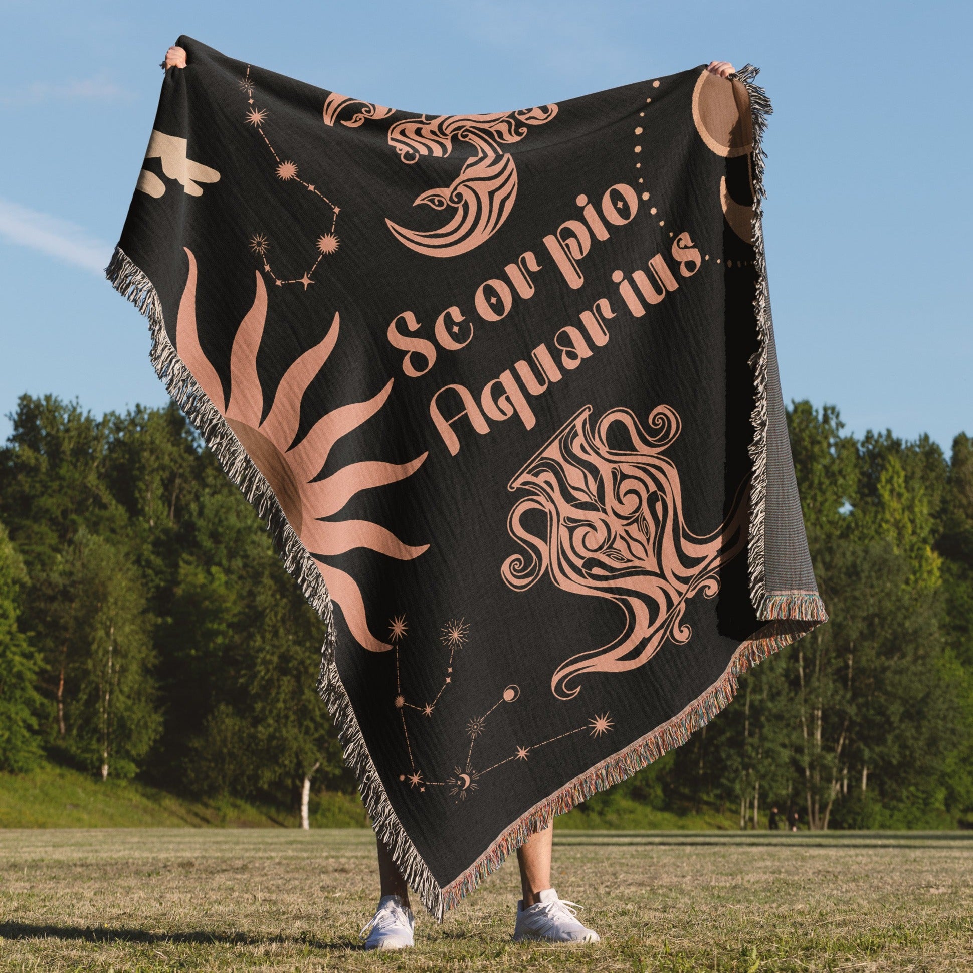 Woven tapestry throw blanket featuring the Aquarius and Scorpio zodiac symbols. Perfect for astrology enthusiasts, this cotton throw blanket adds a touch of boho style and celestial charm to your home decor.