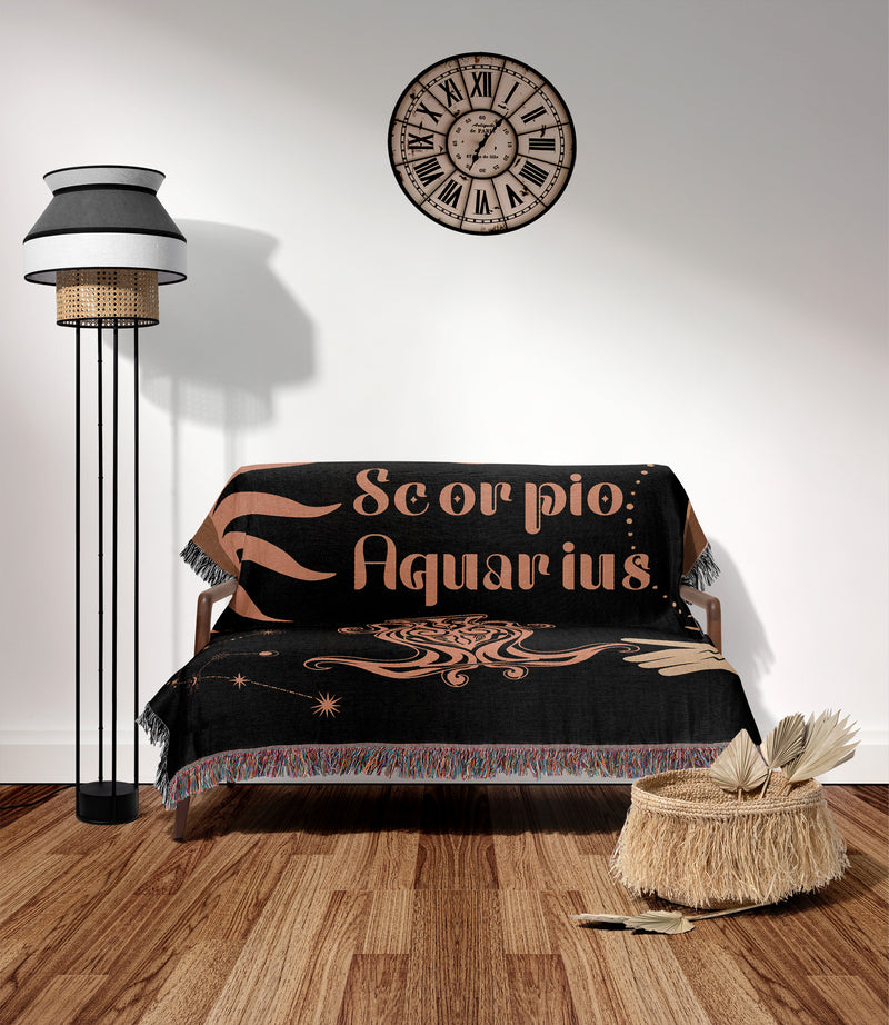 Woven tapestry throw blanket featuring the Aquarius and Scorpio zodiac symbols. Perfect for astrology enthusiasts, this cotton throw blanket adds a touch of boho style and celestial charm to your home decor.