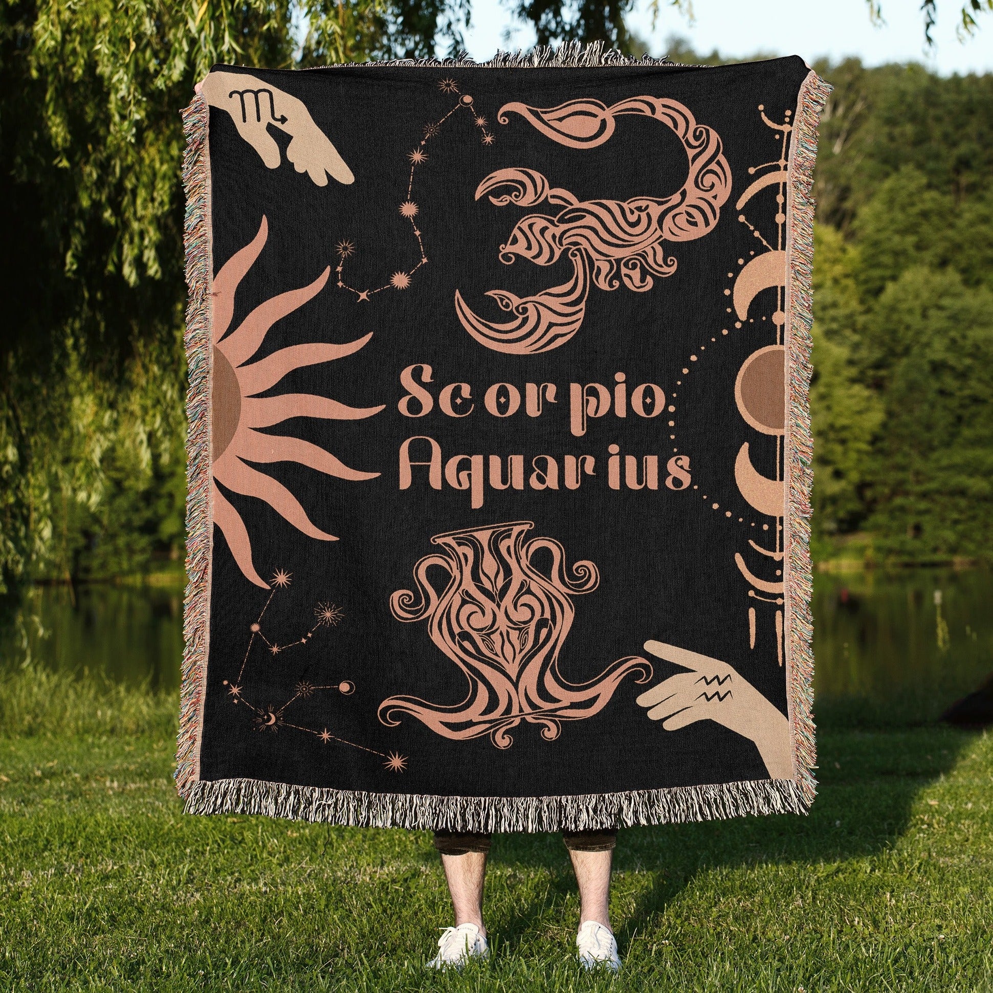 Woven tapestry throw blanket featuring the Aquarius and Scorpio zodiac symbols. Perfect for astrology enthusiasts, this cotton throw blanket adds a touch of boho style and celestial charm to your home decor.
