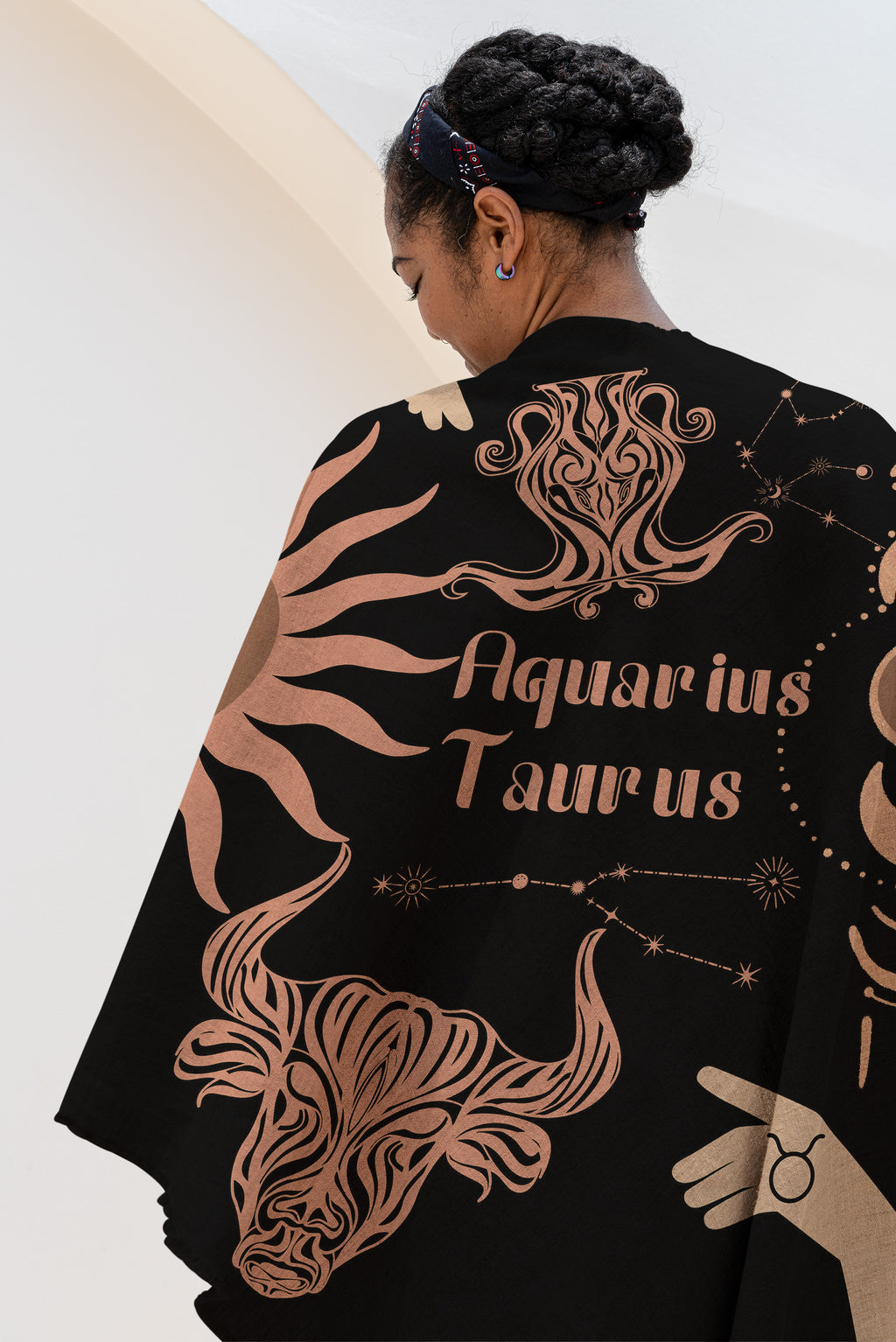 Woven tapestry throw blanket featuring the Aquarius and Taurus zodiac symbols. Perfect for astrology enthusiasts, this cotton throw blanket adds a touch of boho style and celestial charm to your home decor.