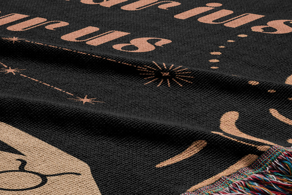 Woven tapestry throw blanket featuring the Aquarius and Taurus zodiac symbols. Perfect for astrology enthusiasts, this cotton throw blanket adds a touch of boho style and celestial charm to your home decor.