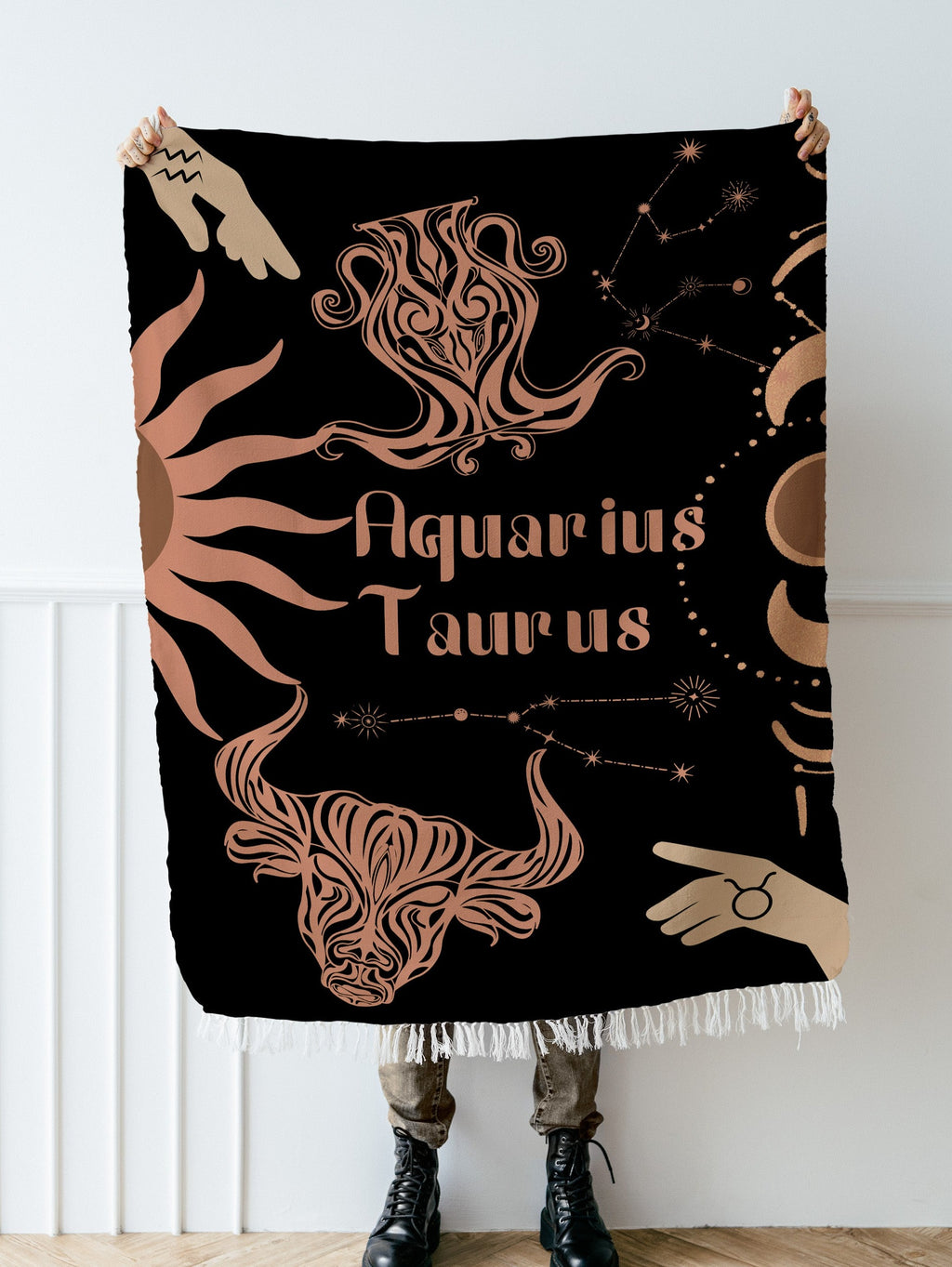 Woven tapestry throw blanket featuring the Aquarius and Taurus zodiac symbols. Perfect for astrology enthusiasts, this cotton throw blanket adds a touch of boho style and celestial charm to your home decor.