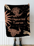 Woven tapestry throw blanket featuring the Aquarius and Taurus zodiac symbols. Perfect for astrology enthusiasts, this cotton throw blanket adds a touch of boho style and celestial charm to your home decor.
