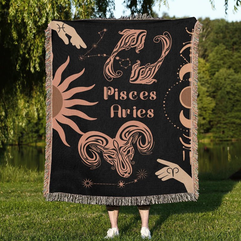 Woven tapestry throw blanket featuring the Aries and Pisces zodiac symbols. Perfect for astrology enthusiasts, this cotton throw blanket adds a touch of boho style and celestial charm to your home decor.