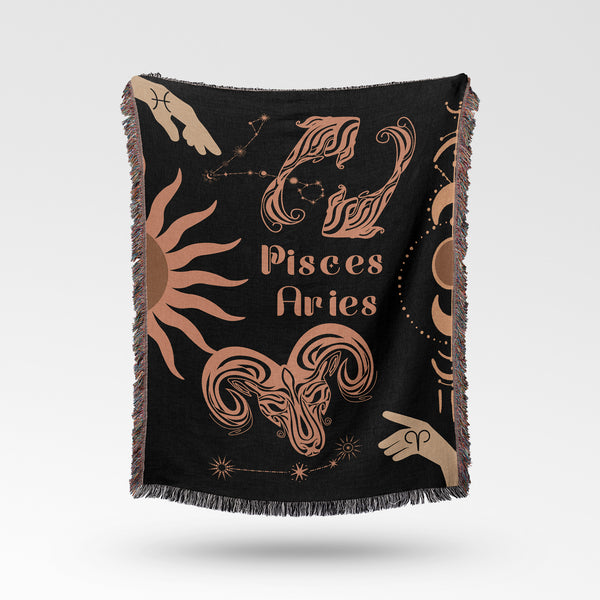 Woven tapestry throw blanket featuring the Aries and Pisces zodiac symbols. Perfect for astrology enthusiasts, this cotton throw blanket adds a touch of boho style and celestial charm to your home decor.