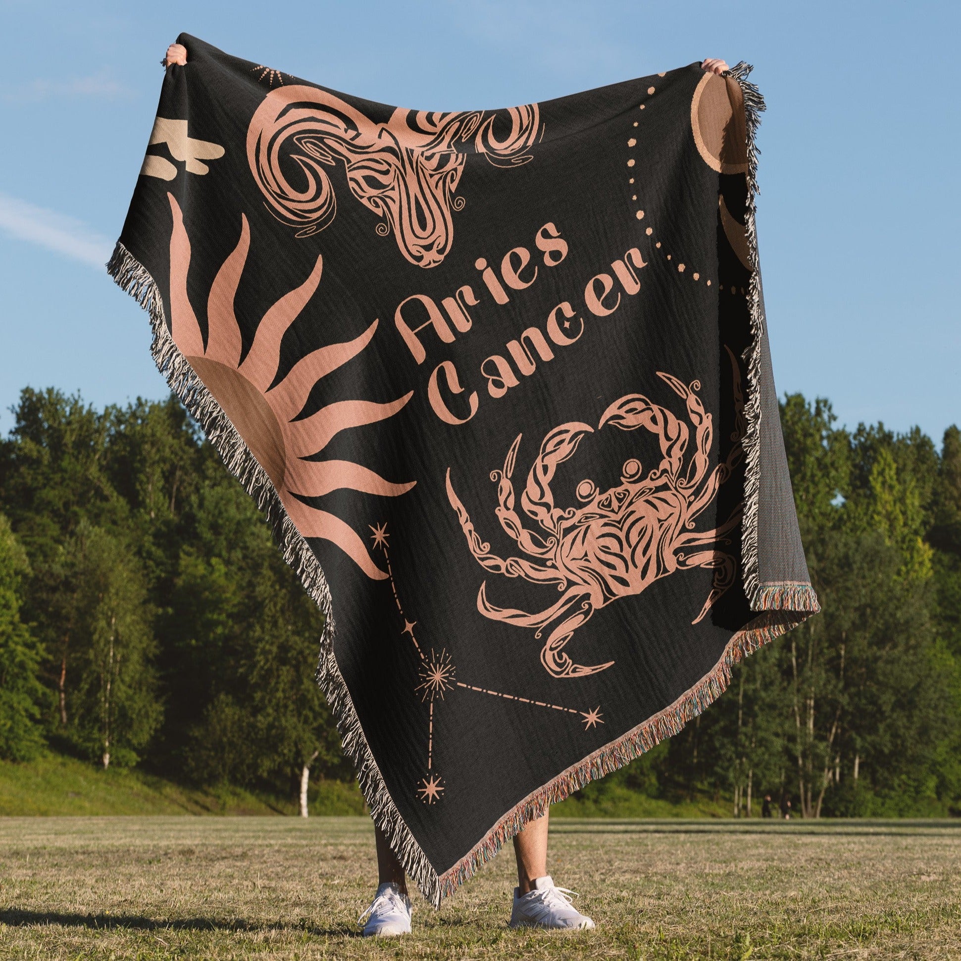 Woven tapestry throw blanket featuring the Aries and Cancer zodiac symbols. Perfect for astrology enthusiasts, this cotton throw blanket adds a touch of boho style and celestial charm to your home decor.