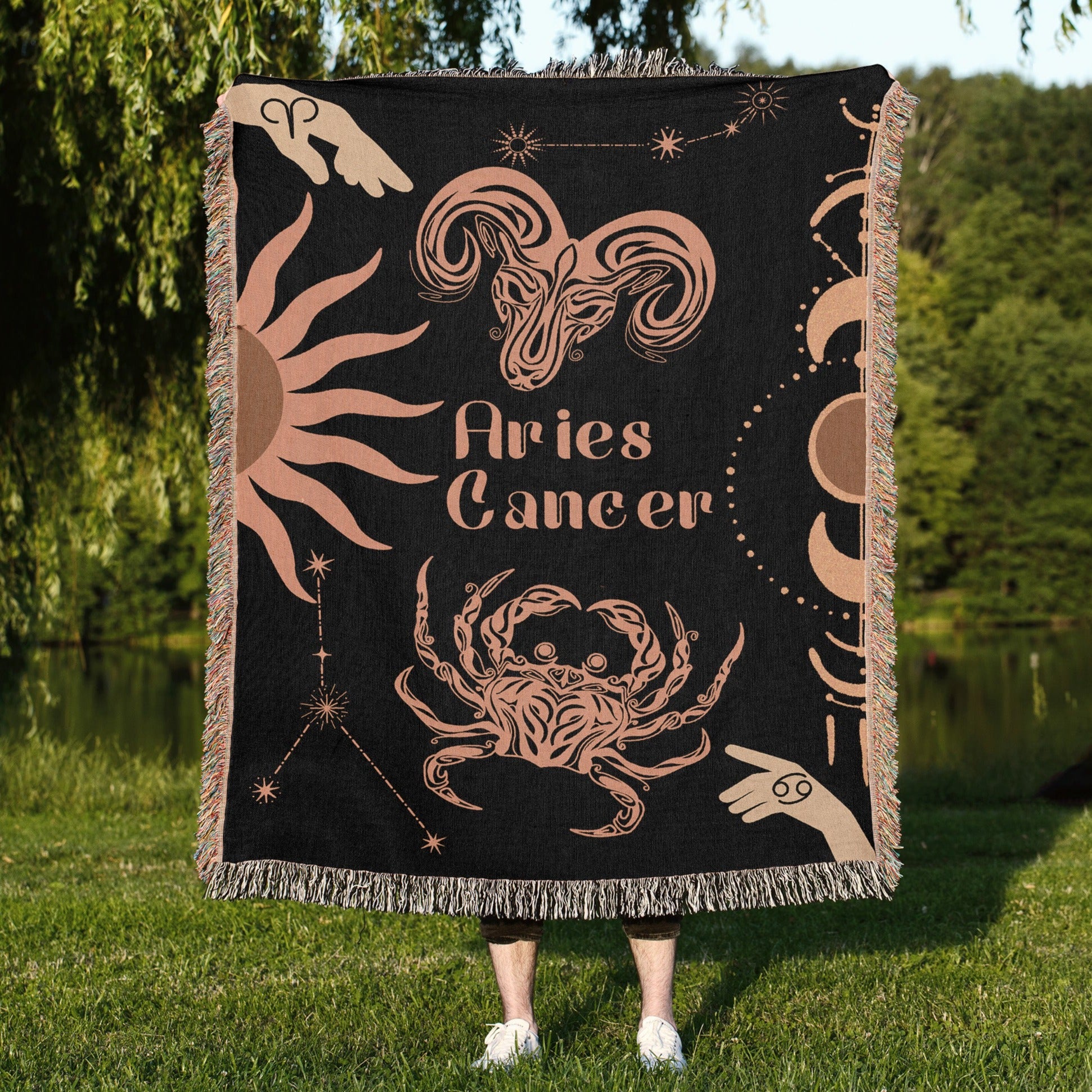 Woven tapestry throw blanket featuring the Aries and Cancer zodiac symbols. Perfect for astrology enthusiasts, this cotton throw blanket adds a touch of boho style and celestial charm to your home decor.