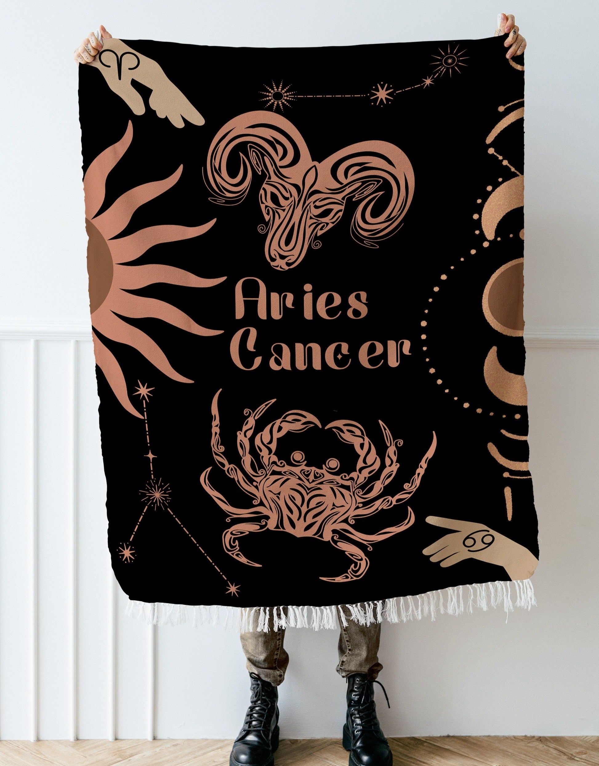 Woven tapestry throw blanket featuring the Aries and Cancer zodiac symbols. Perfect for astrology enthusiasts, this cotton throw blanket adds a touch of boho style and celestial charm to your home decor.
