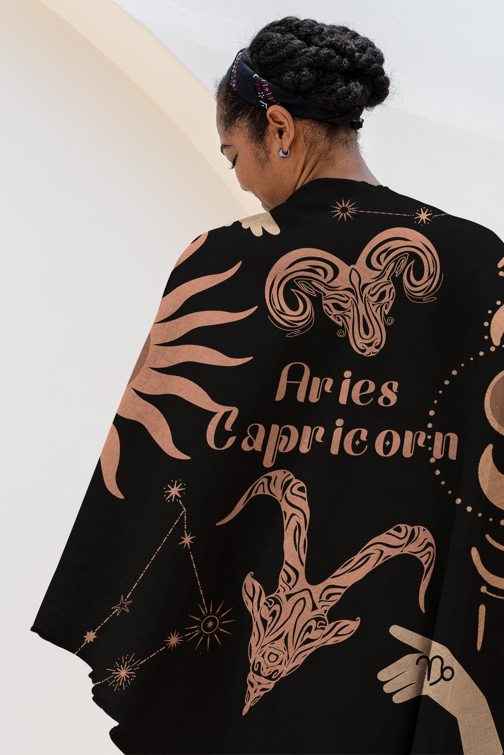 Woven tapestry throw blanket featuring the Aries and Capricorn zodiac symbols. Perfect for astrology enthusiasts, this cotton throw blanket adds a touch of boho style and celestial charm to your home decor.