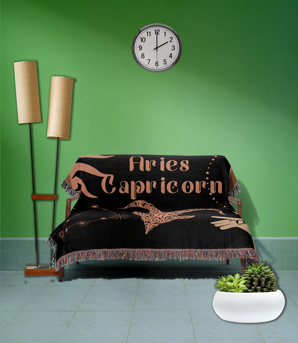 Woven tapestry throw blanket featuring the Aries and Capricorn zodiac symbols. Perfect for astrology enthusiasts, this cotton throw blanket adds a touch of boho style and celestial charm to your home decor.