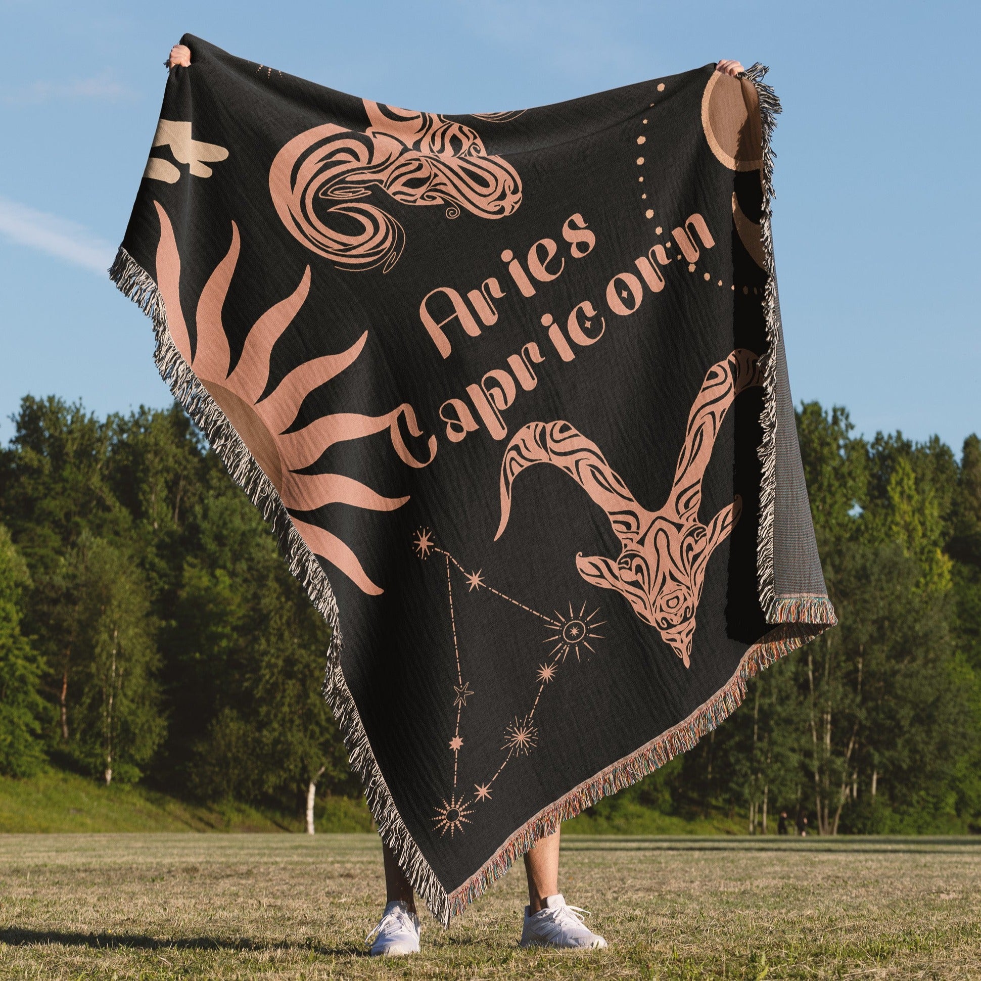 Woven tapestry throw blanket featuring the Aries and Capricorn zodiac symbols. Perfect for astrology enthusiasts, this cotton throw blanket adds a touch of boho style and celestial charm to your home decor.