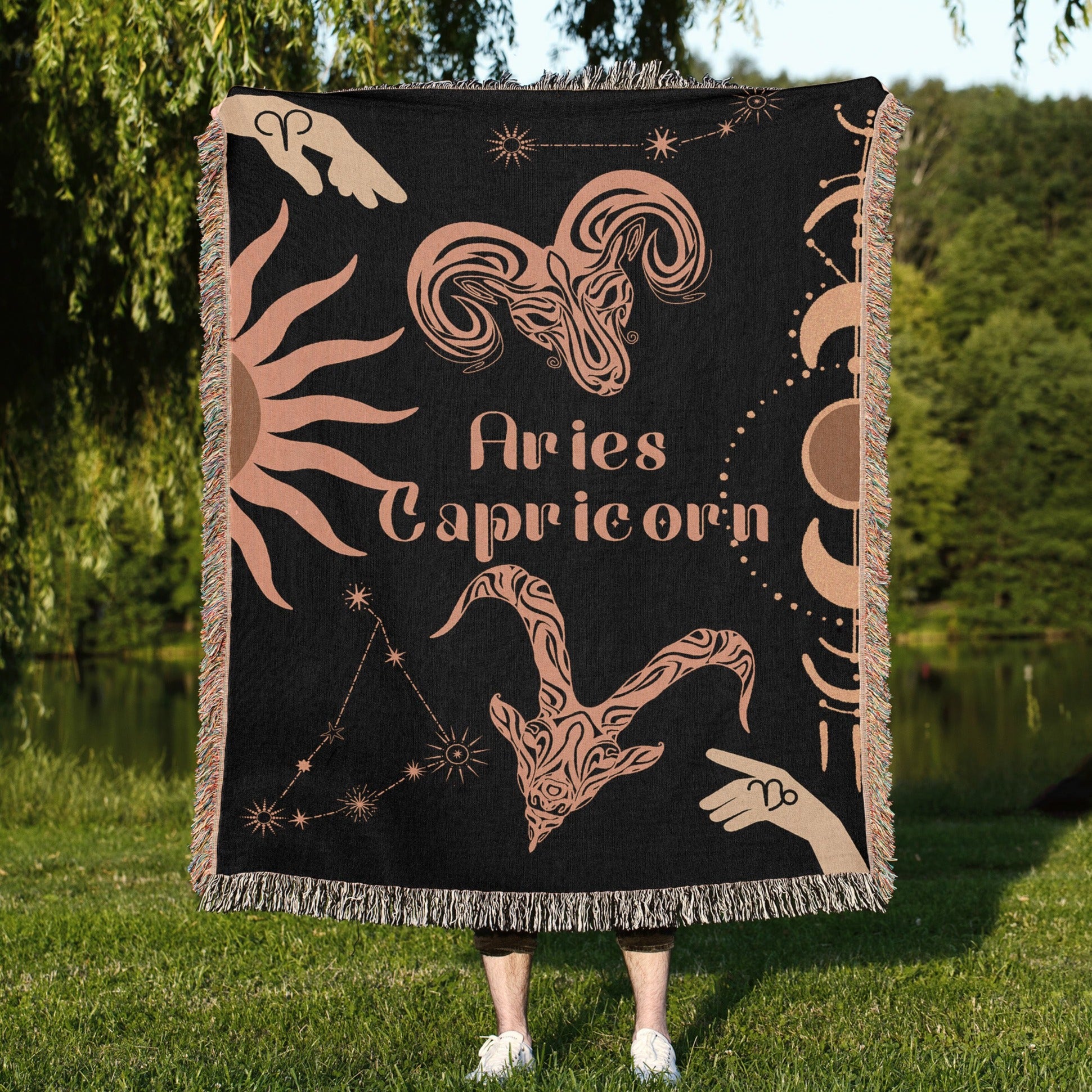 Woven tapestry throw blanket featuring the Aries and Capricorn zodiac symbols. Perfect for astrology enthusiasts, this cotton throw blanket adds a touch of boho style and celestial charm to your home decor.