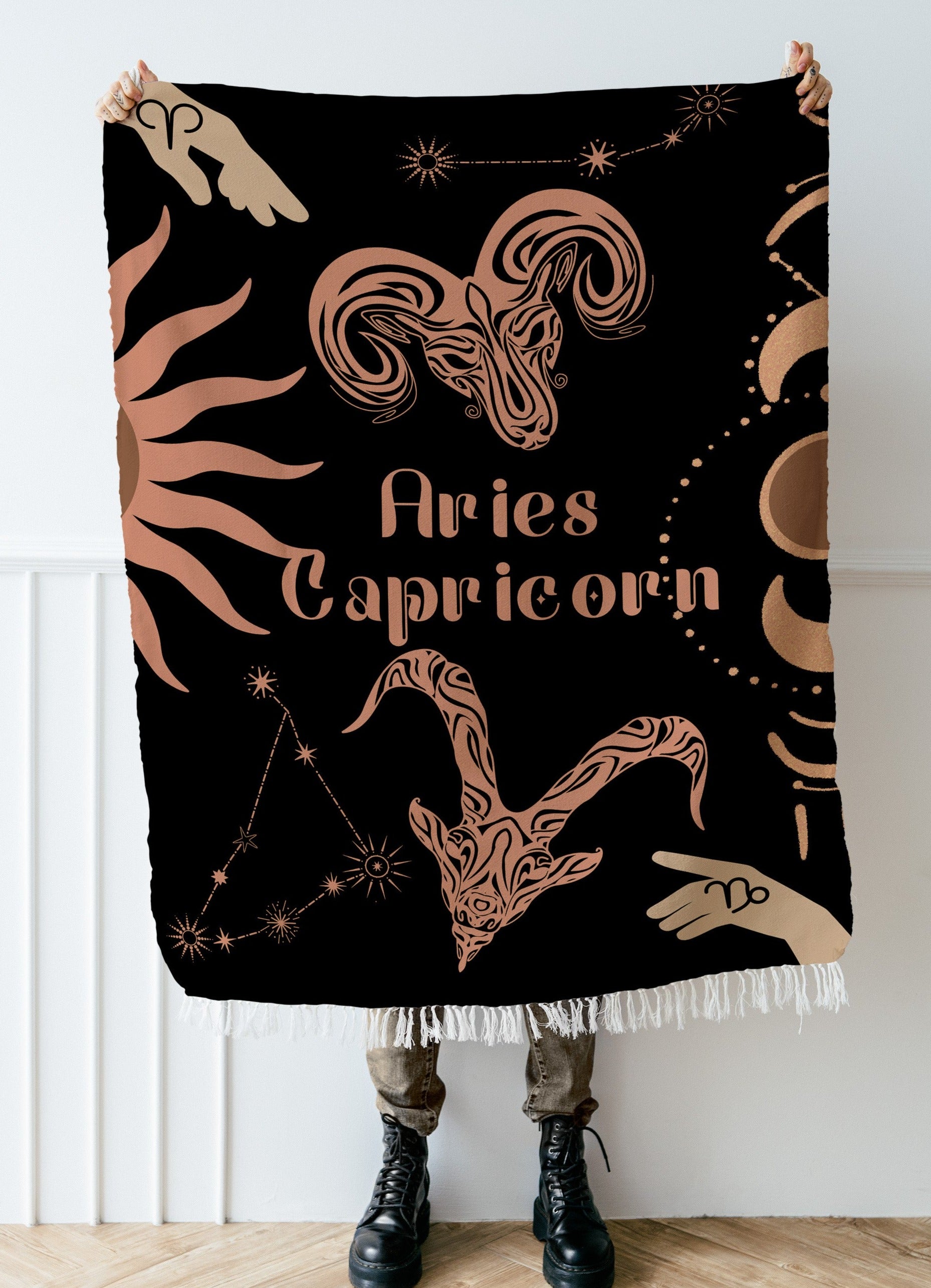 Woven tapestry throw blanket featuring the Aries and Capricorn zodiac symbols. Perfect for astrology enthusiasts, this cotton throw blanket adds a touch of boho style and celestial charm to your home decor.