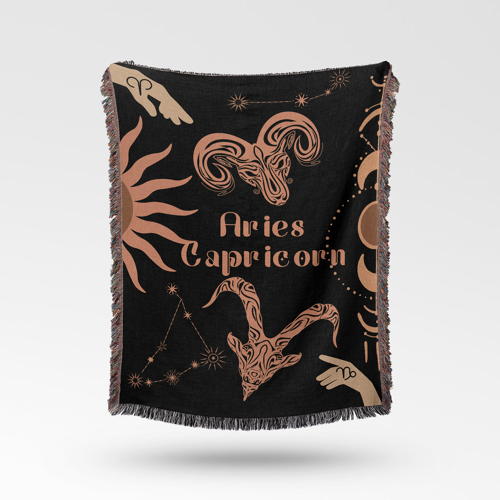 Woven tapestry throw blanket featuring the Aries and Capricorn zodiac symbols. Perfect for astrology enthusiasts, this cotton throw blanket adds a touch of boho style and celestial charm to your home decor.