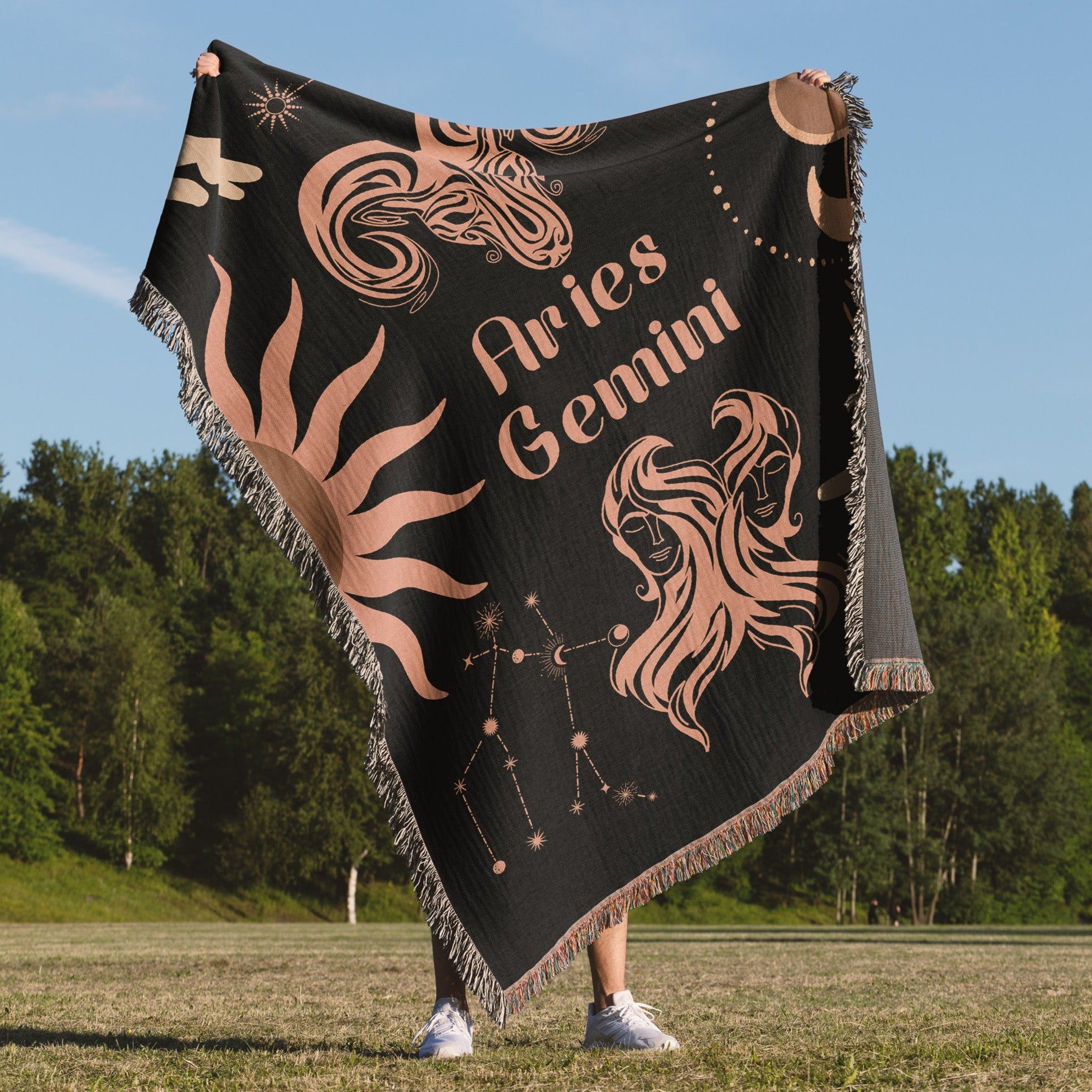 Woven tapestry throw blanket featuring the Aries and Gemini zodiac symbols. Perfect for astrology enthusiasts, this cotton throw blanket adds a touch of boho style and celestial charm to your home decor.