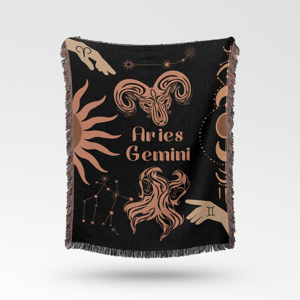 Woven tapestry throw blanket featuring the Aries and Gemini zodiac symbols. Perfect for astrology enthusiasts, this cotton throw blanket adds a touch of boho style and celestial charm to your home decor.