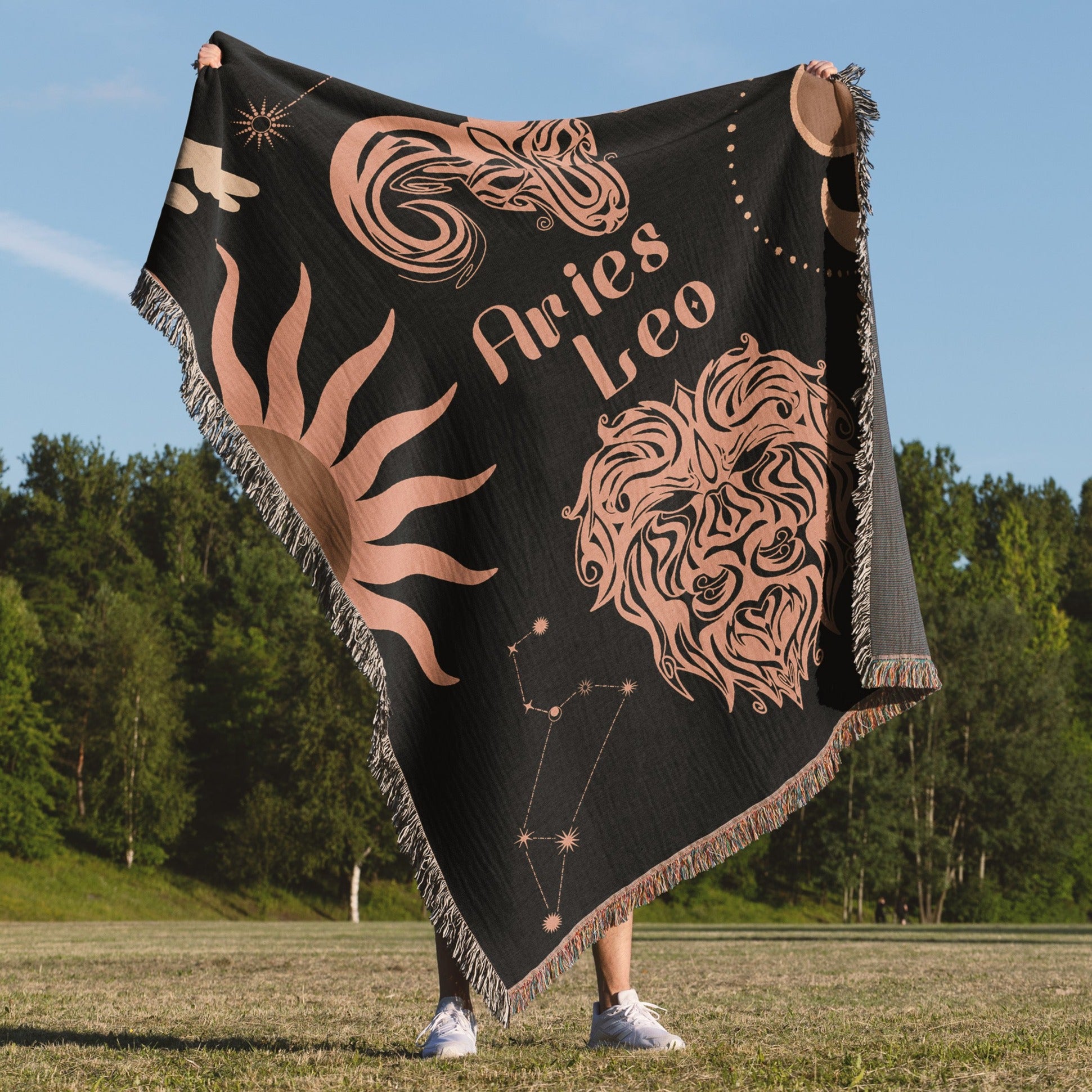 Woven tapestry throw blanket featuring the Aries and Leo zodiac symbols. Perfect for astrology enthusiasts, this cotton throw blanket adds a touch of boho style and celestial charm to your home decor.