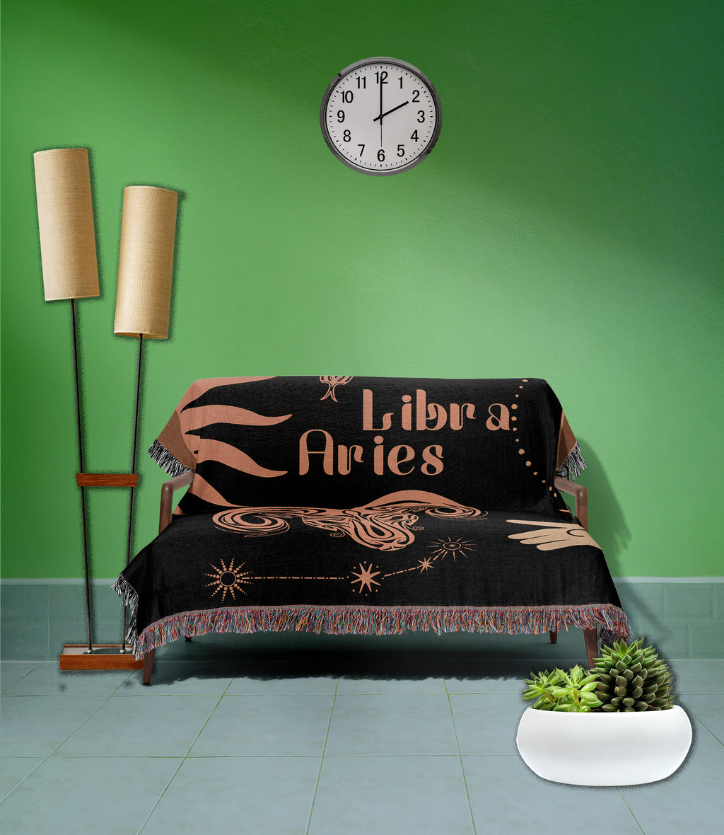 Woven tapestry throw blanket featuring the Aries and Libra zodiac symbols. Perfect for astrology enthusiasts, this cotton throw blanket adds a touch of boho style and celestial charm to your home decor.