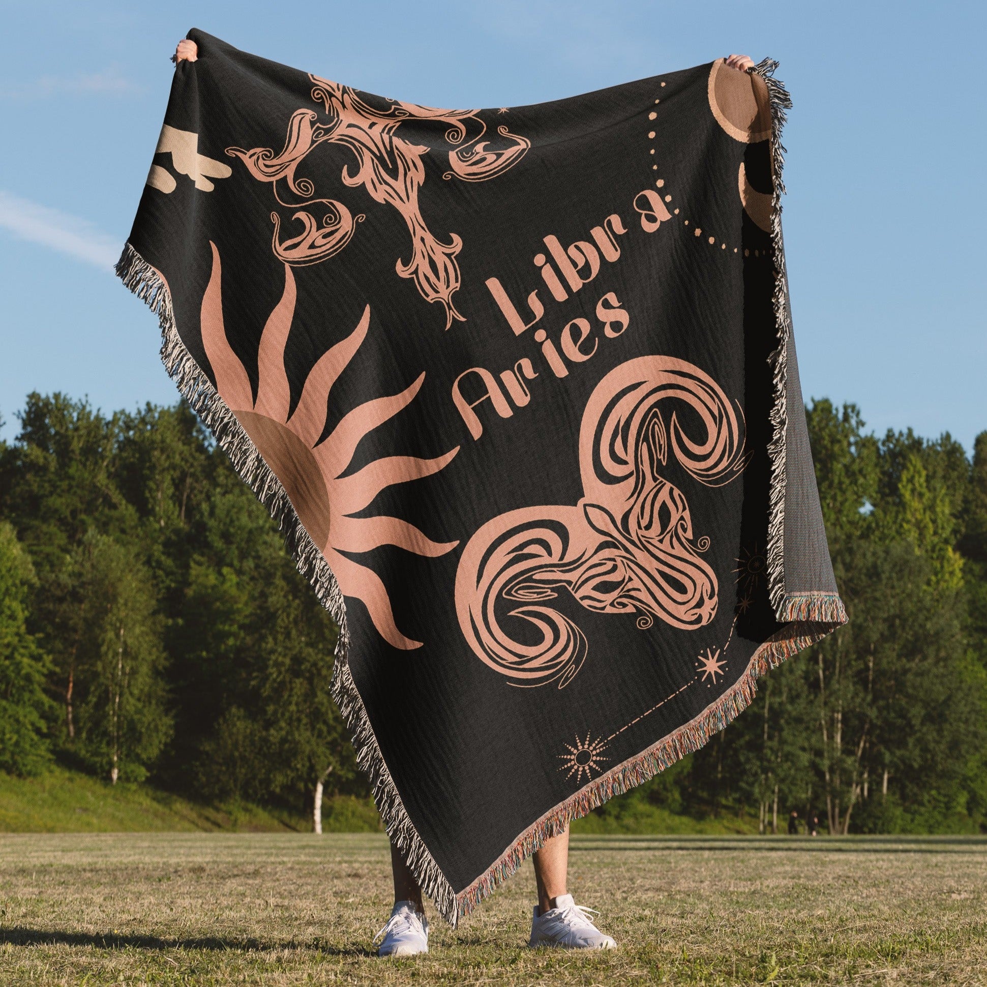 Woven tapestry throw blanket featuring the Aries and Libra zodiac symbols. Perfect for astrology enthusiasts, this cotton throw blanket adds a touch of boho style and celestial charm to your home decor.
