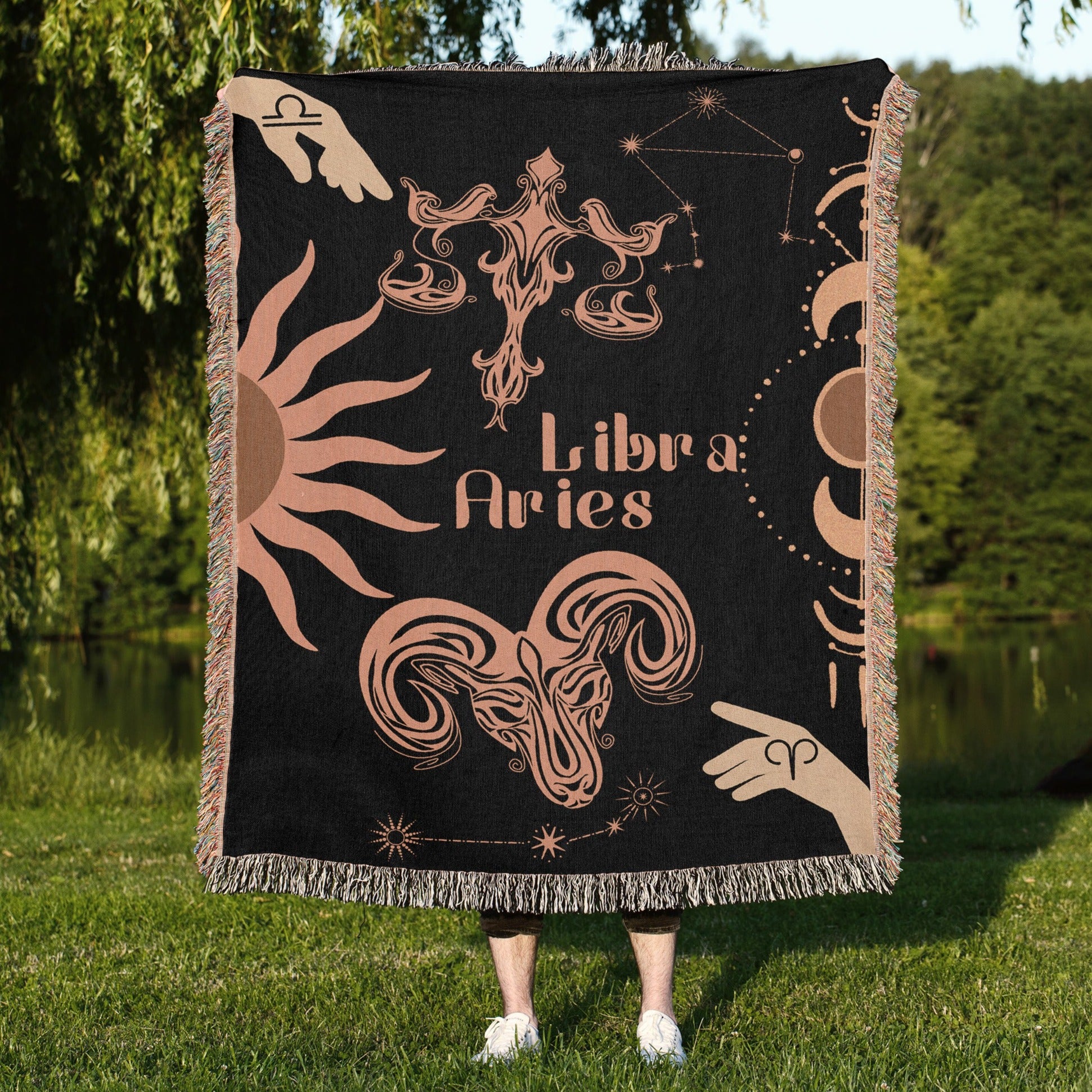 Woven tapestry throw blanket featuring the Aries and Libra zodiac symbols. Perfect for astrology enthusiasts, this cotton throw blanket adds a touch of boho style and celestial charm to your home decor.