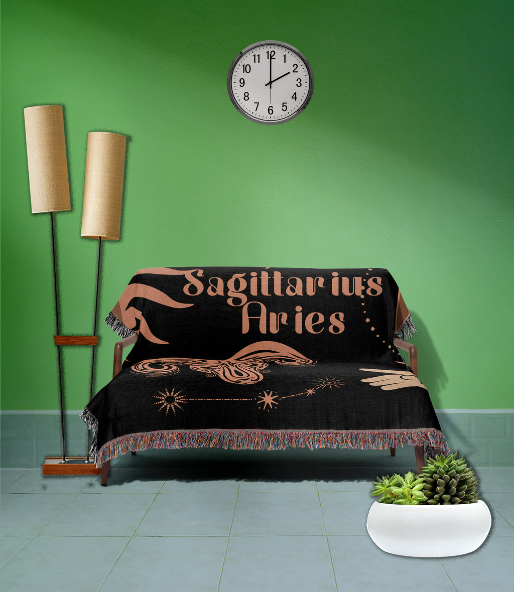 Woven tapestry throw blanket featuring the Aries and Sagittarius zodiac symbols. Perfect for astrology enthusiasts, this cotton throw blanket adds a touch of boho style and celestial charm to your home decor
