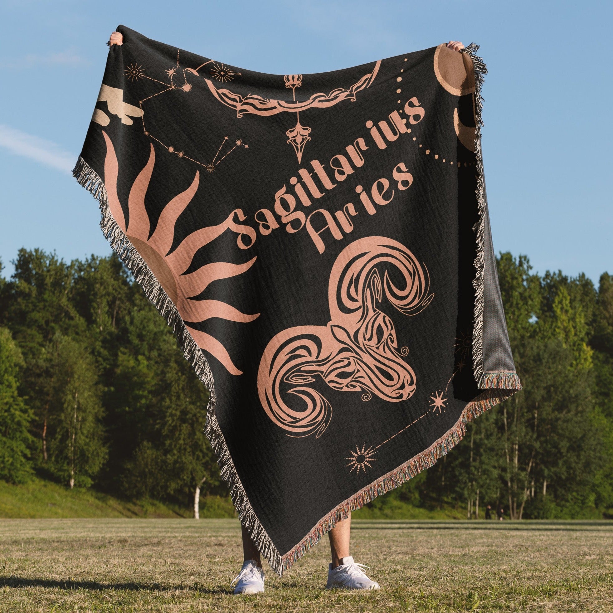 Woven tapestry throw blanket featuring the Aries and Sagittarius zodiac symbols. Perfect for astrology enthusiasts, this cotton throw blanket adds a touch of boho style and celestial charm to your home decor
