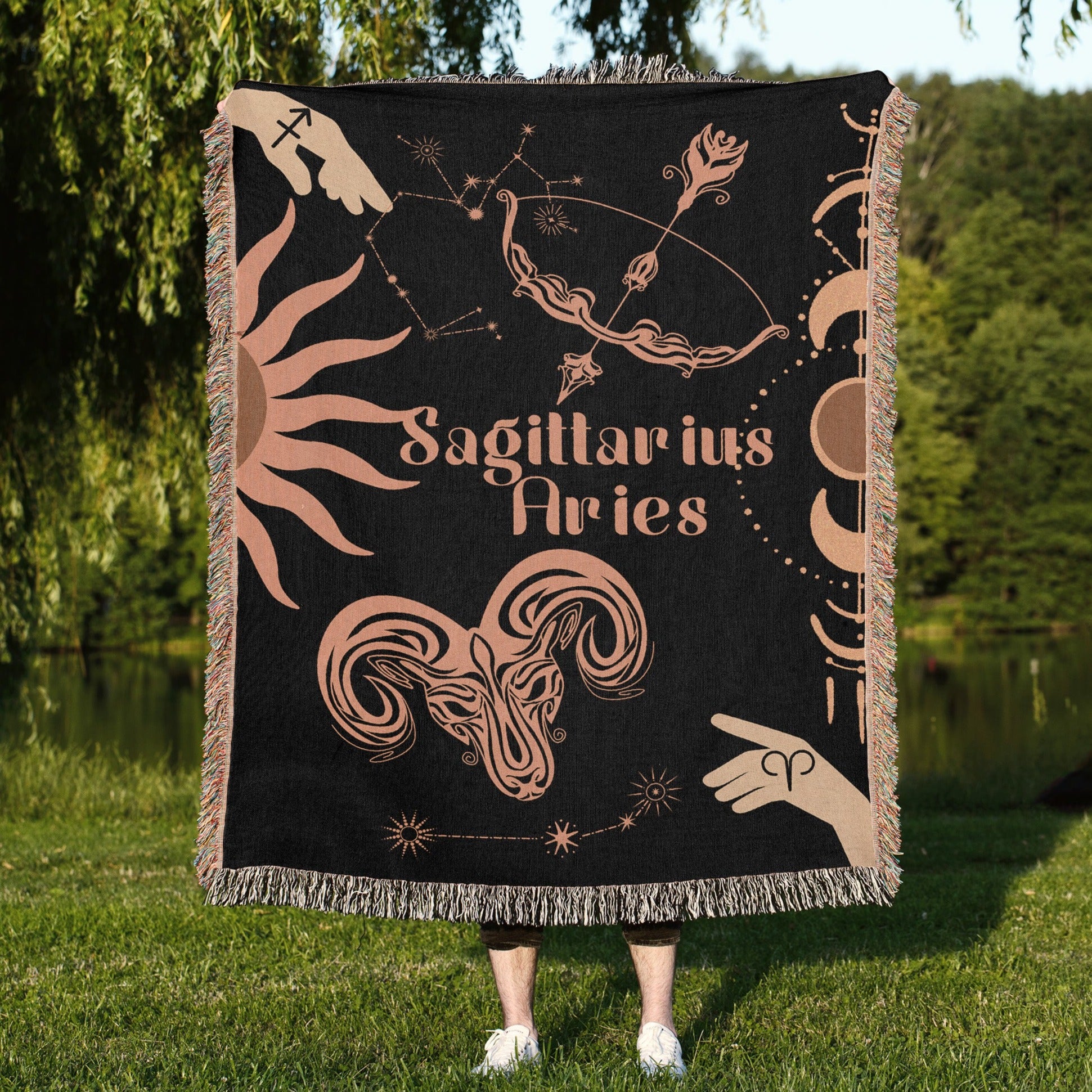 Woven tapestry throw blanket featuring the Aries and Sagittarius zodiac symbols. Perfect for astrology enthusiasts, this cotton throw blanket adds a touch of boho style and celestial charm to your home decor